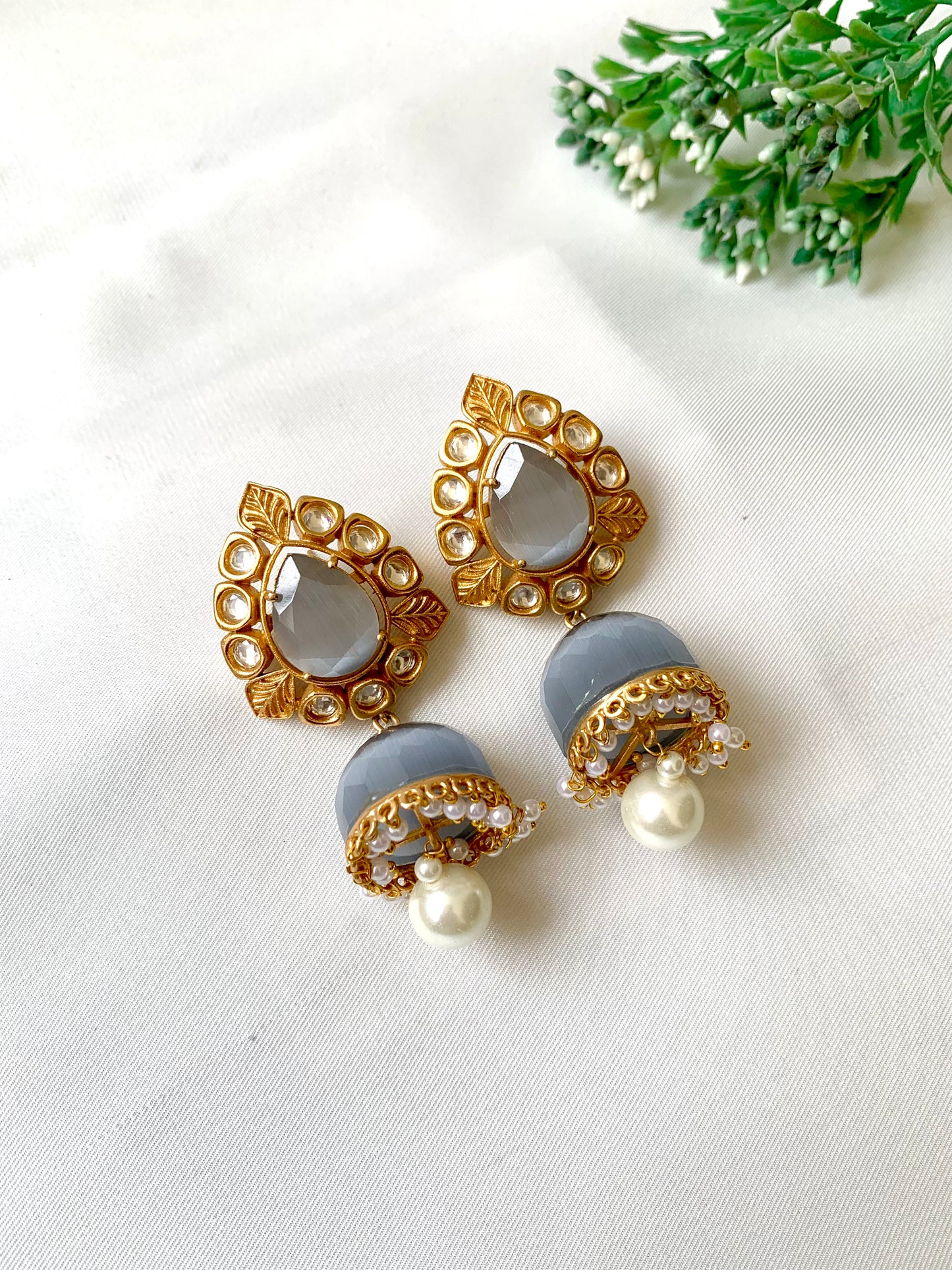 Seren handcrafted 22kt gold plated Jhumka featuring Polki Kundan, semi-precious Grey Onyx and Pearls