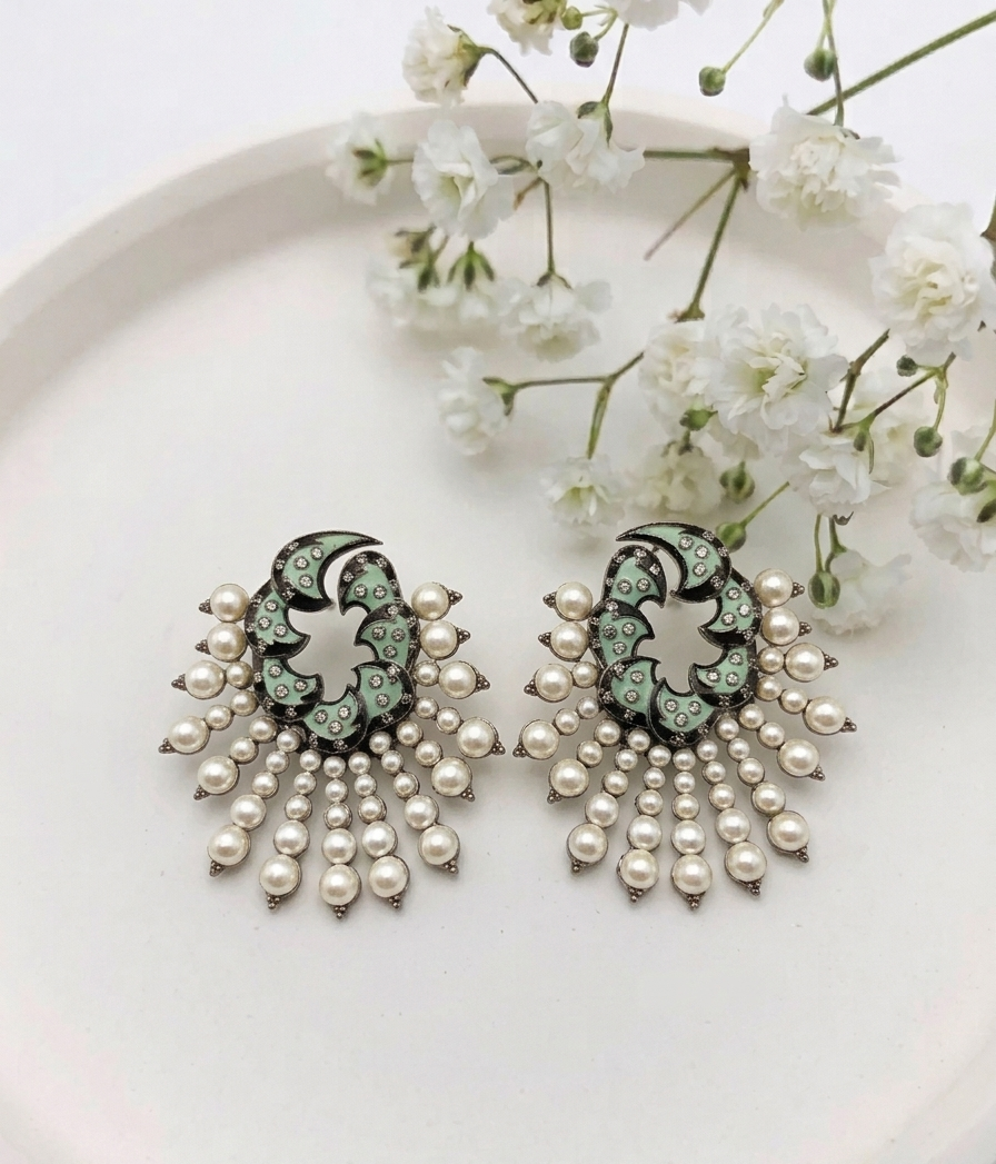 Shaniya handcrafted rhodium plated oxidized earrings with American Diamonds, semi-precious Pearls and hand-painted Meena