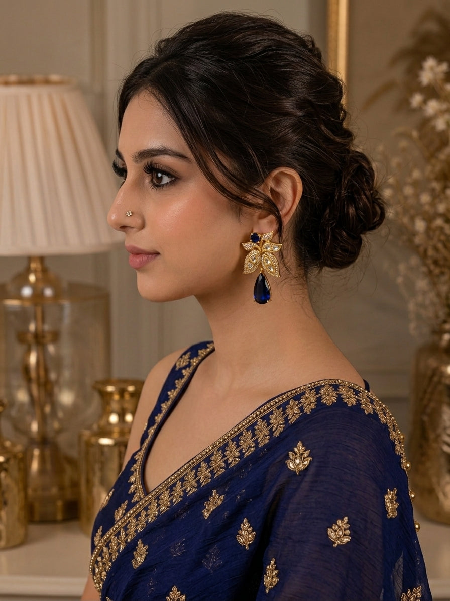 Beenam handcrafted 22kt Gold plated earrings featuring Polki Kundan, American Diamonds and semi-precious Sapphire
