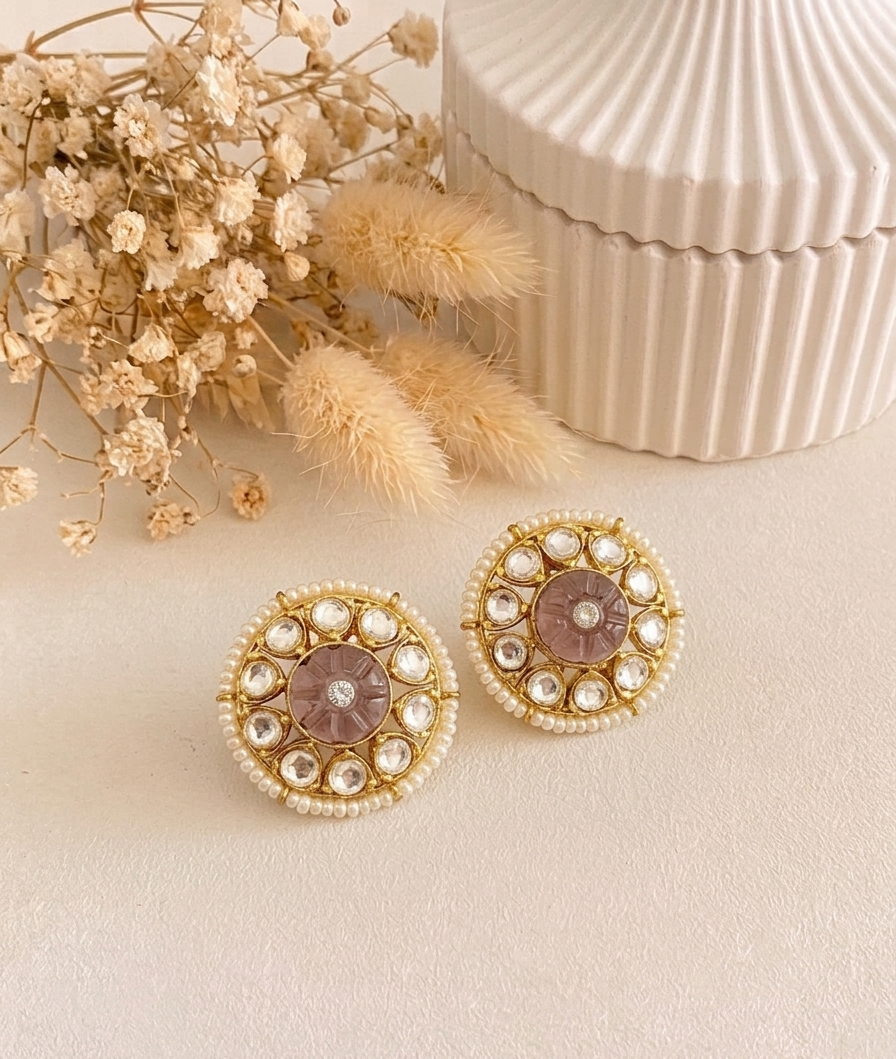 Sofi handcrafted 22kt gold plated studs featuring Polki Kundan, semi-precious hand-carved Amethyst, and Pearls