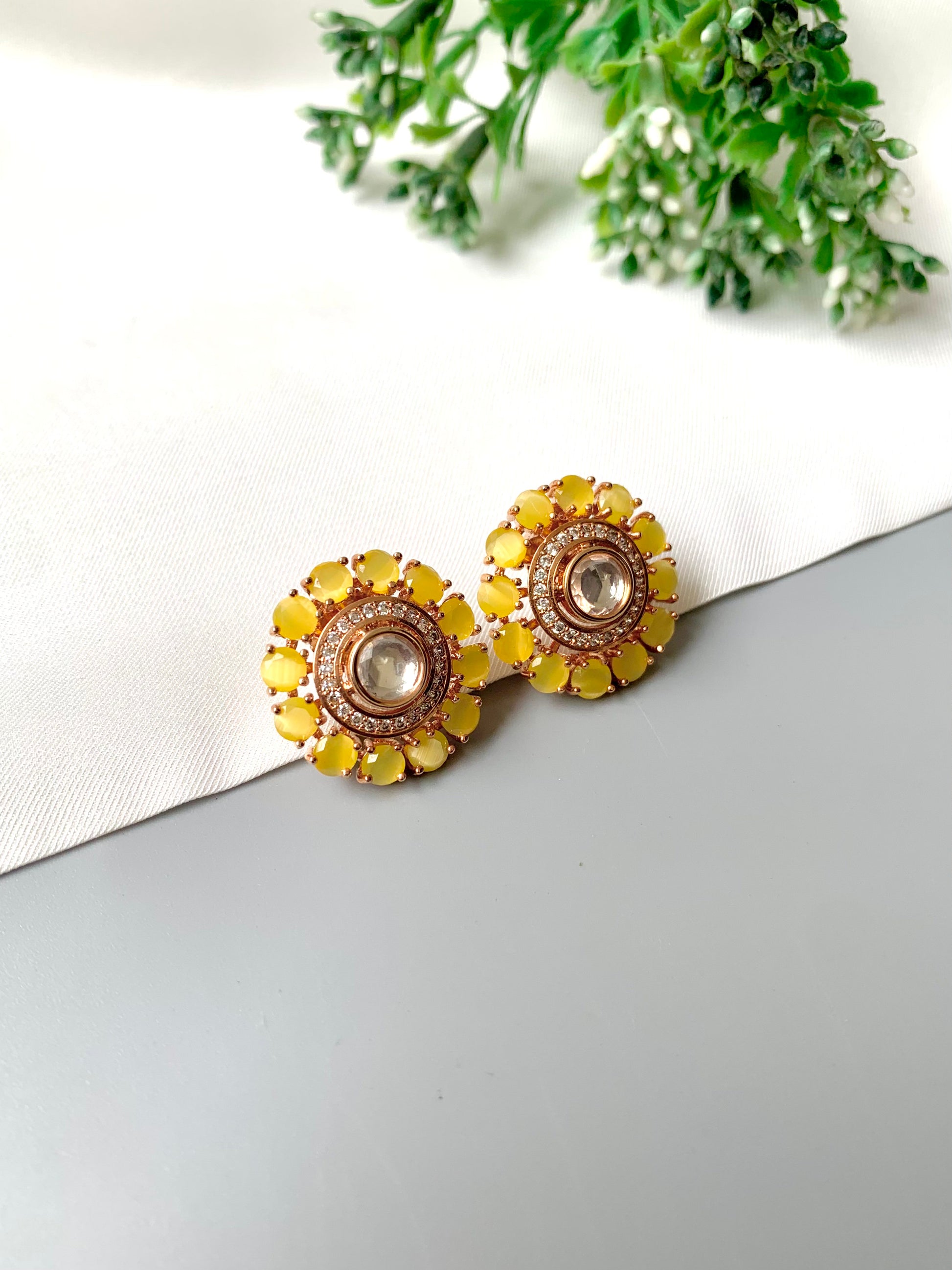 Side angle of yellow Sunlit Noor studs highlighting intricate detailing