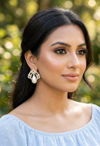 Veeda gold plated earrings with American diamonds and pearl accents