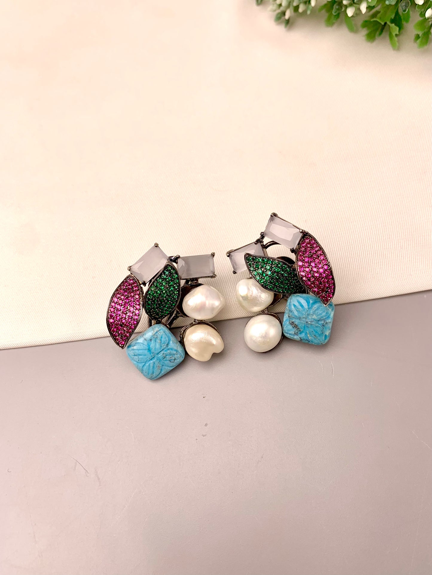 Visha handcrafted rhodium plated oxidized studs featuring real Baroque Pearls, hand-carved Feroza, pearls, and genuine Emerald and Ruby Swarovski crystals
