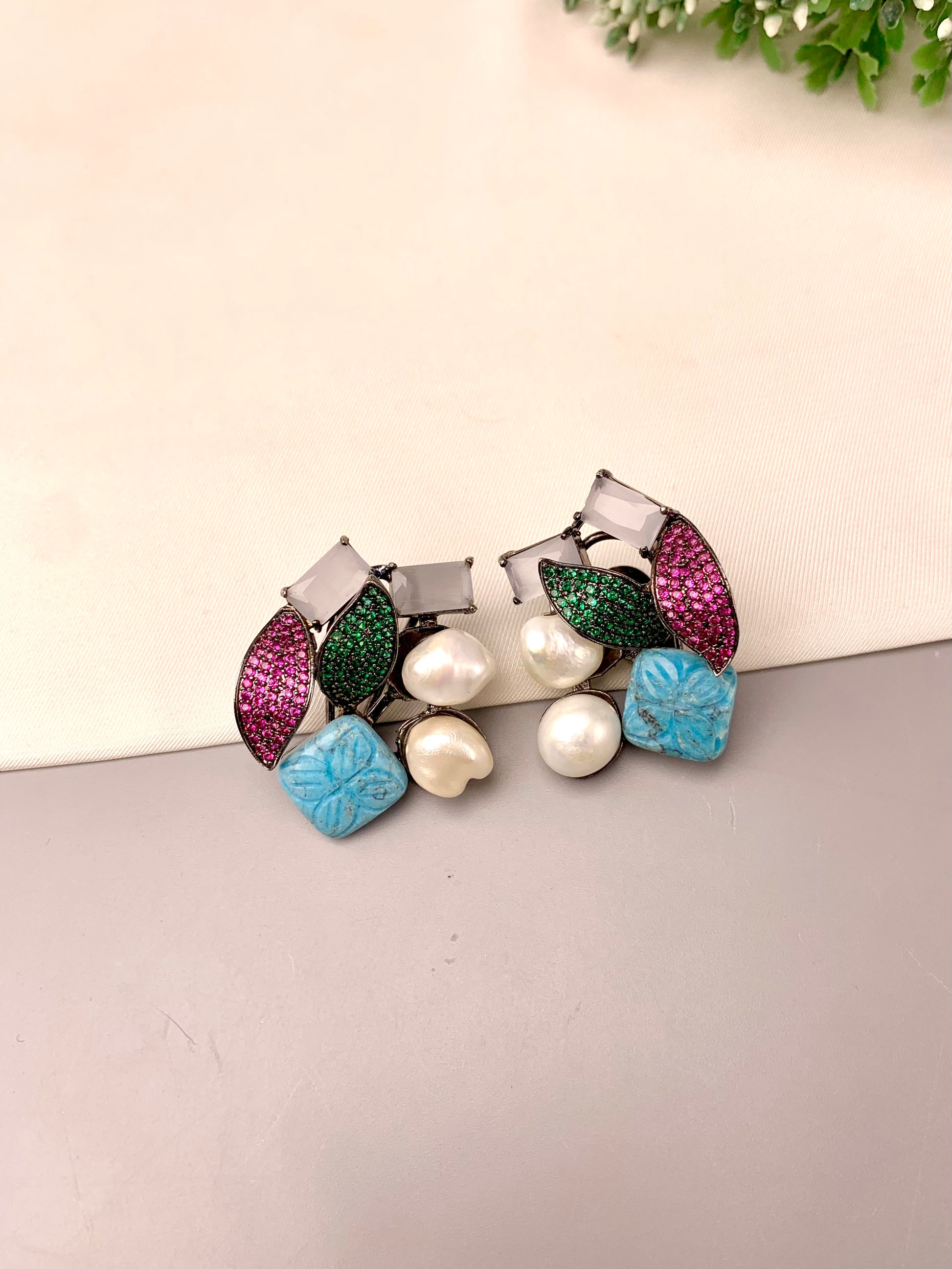 Visha handcrafted rhodium plated oxidized studs featuring real Baroque Pearls, hand-carved Feroza, pearls, and genuine Emerald and Ruby Swarovski crystals