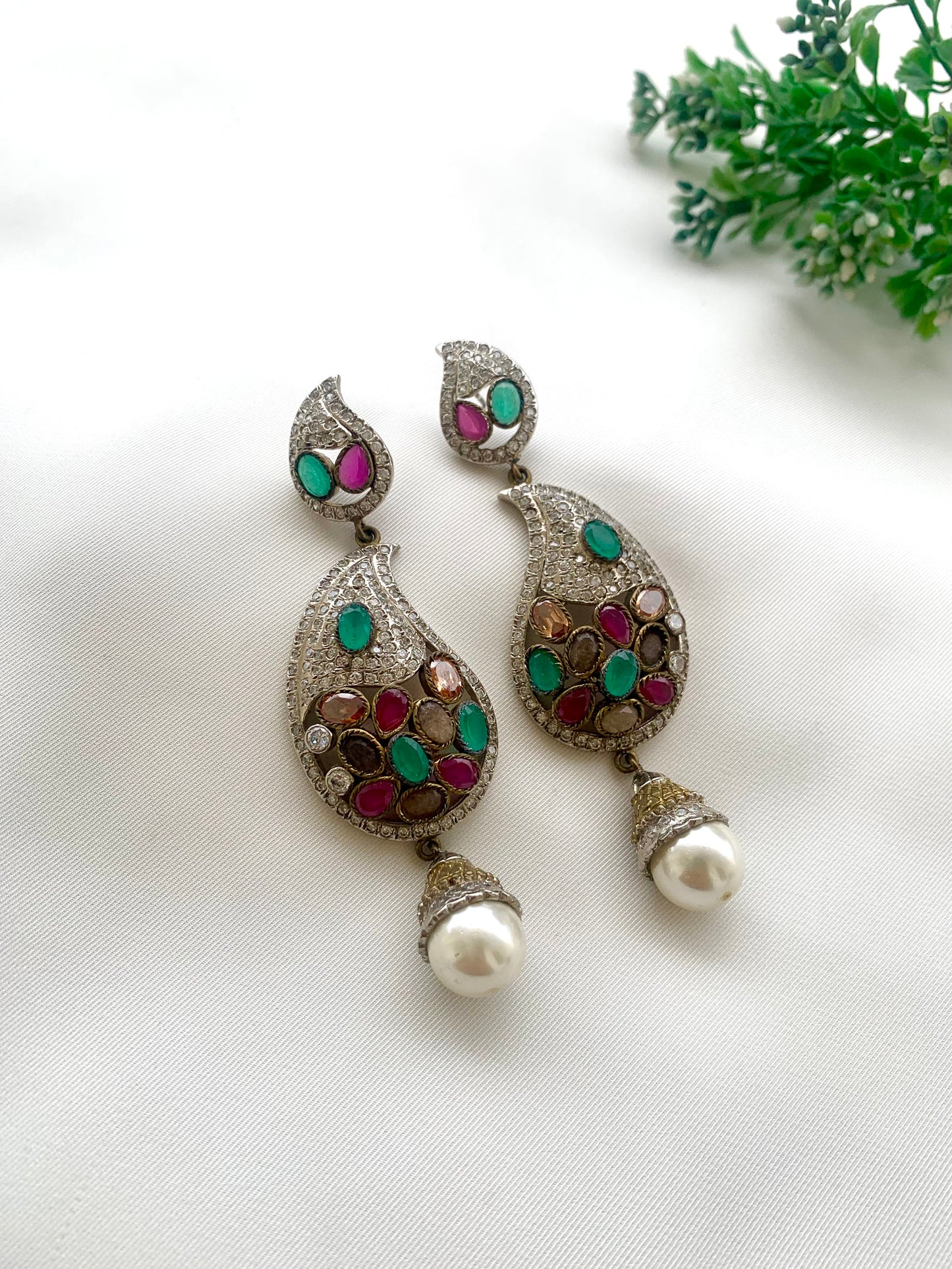 Vilde handcrafted rhodium plated Victorian finish earrings featuring American Diamonds, semi-precious Ruby, Emerald, Champagne, Nauratan gemstones, and Pearls