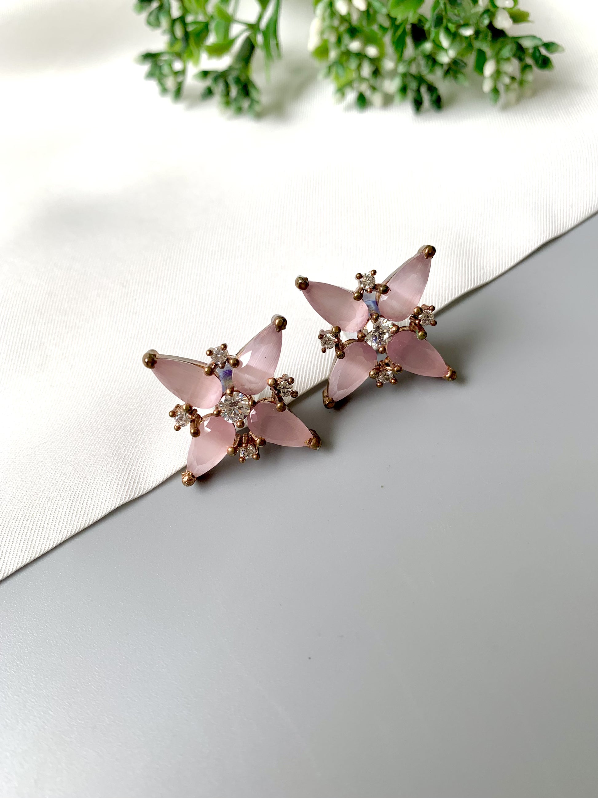 Elegant Rose Quartz floral earrings with black oxidized polish – close-up