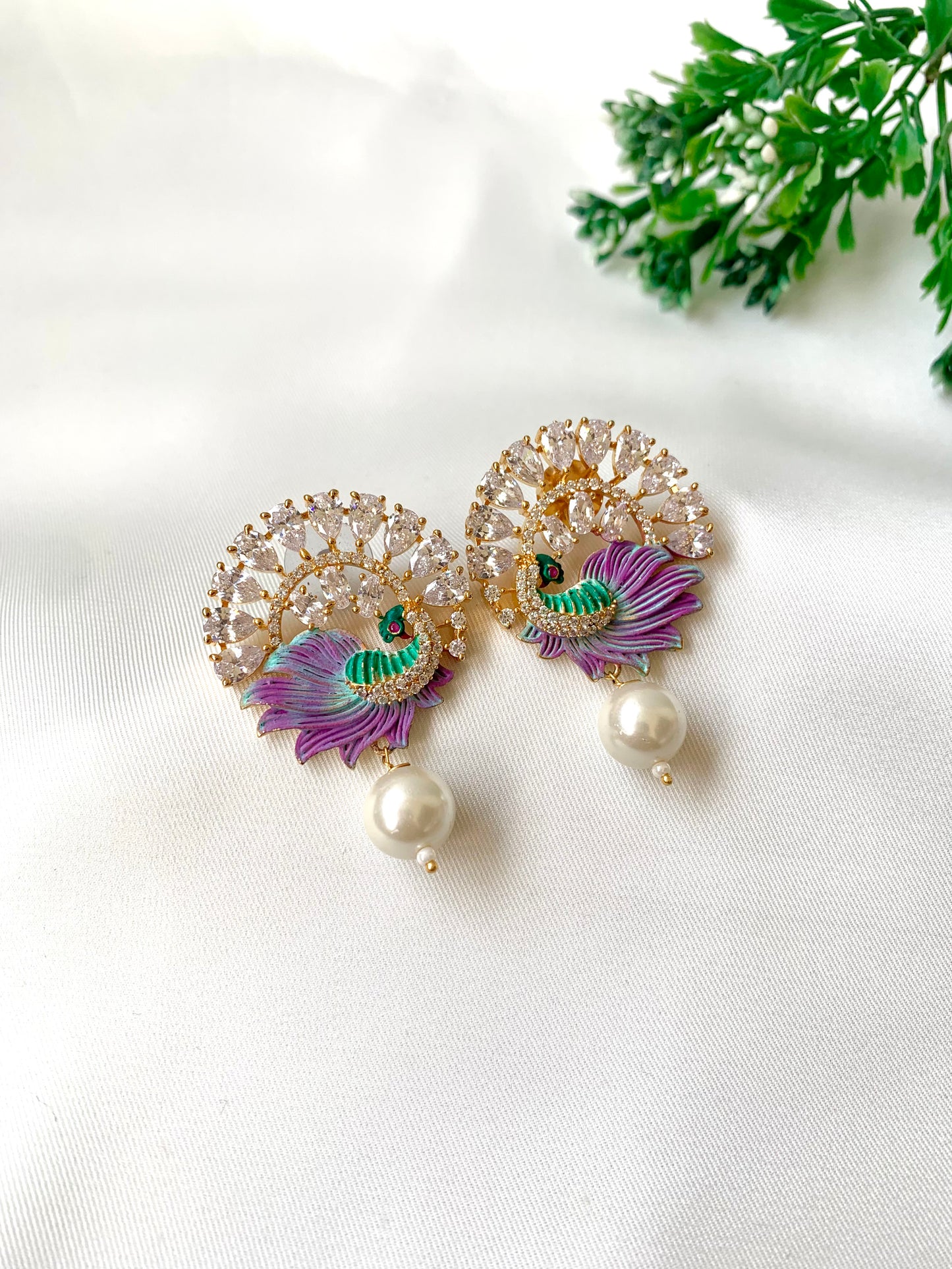 Hand crafted Vire  peacock designer earrings in 22kt gold plating with American Diamonds, semi-precious pearls and hand-painted Meena