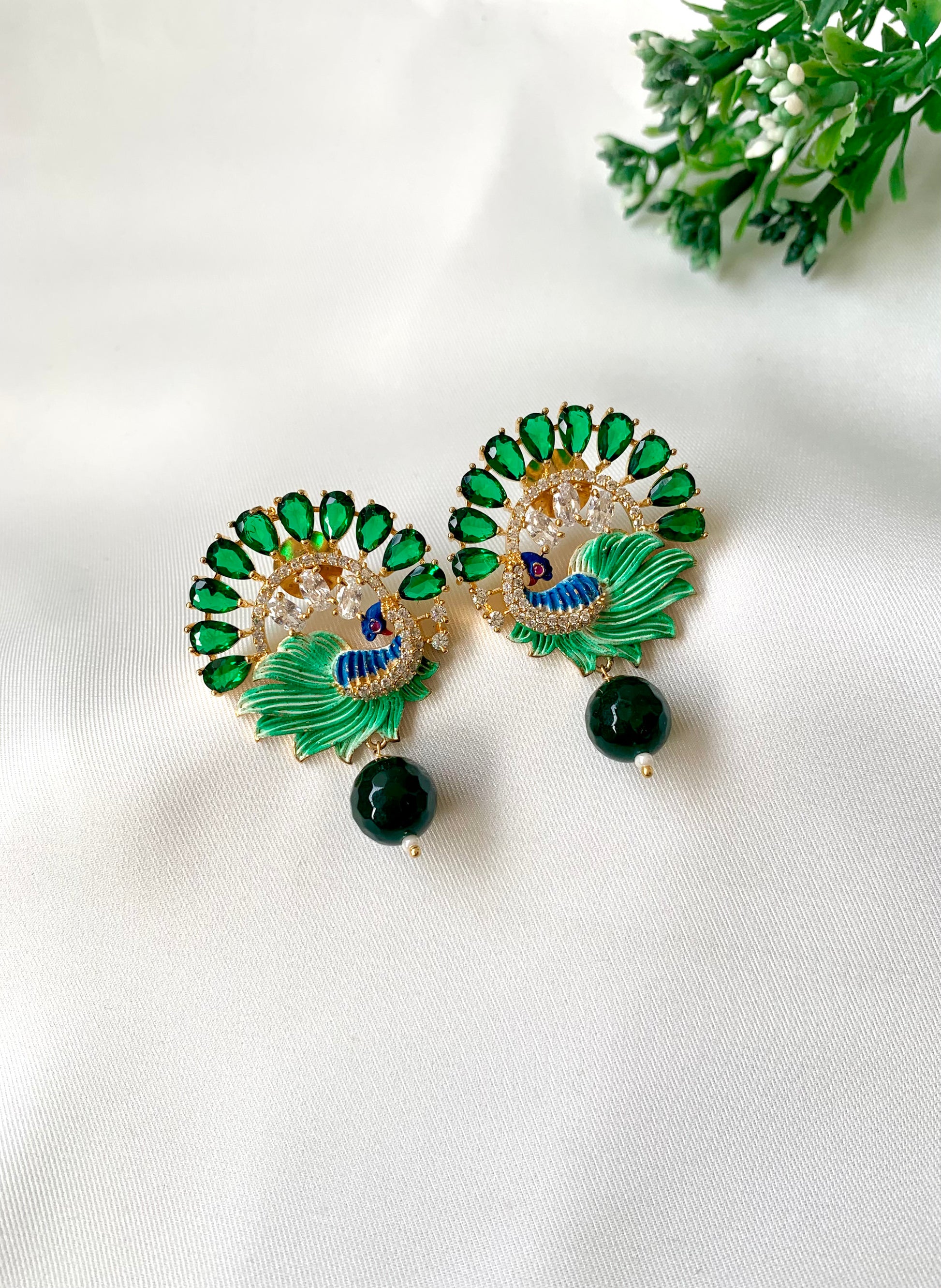 Hand crafted Vire Emerald peacock designer earrings in 22kt gold plating with American Diamonds, semi-precious emerald and hand-painted Meena