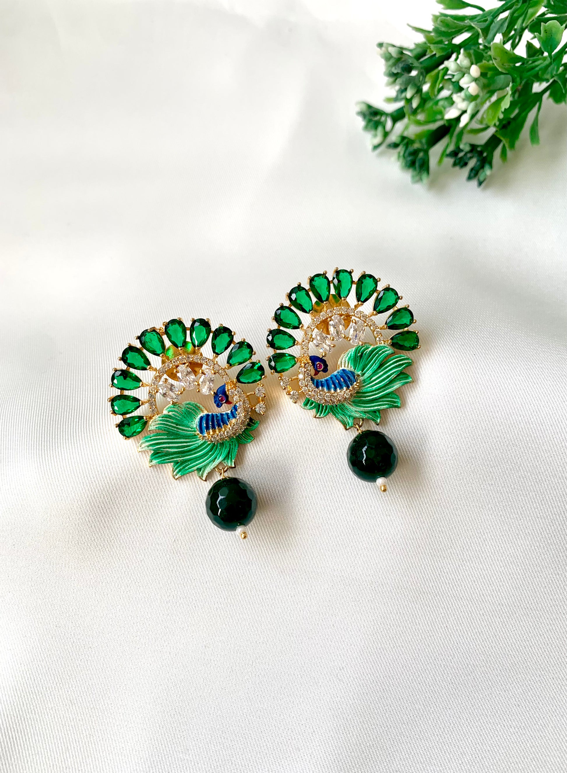 Hand crafted Vire Emerald peacock designer earrings in 22kt gold plating with American Diamonds, semi-precious emerald and hand-painted Meena