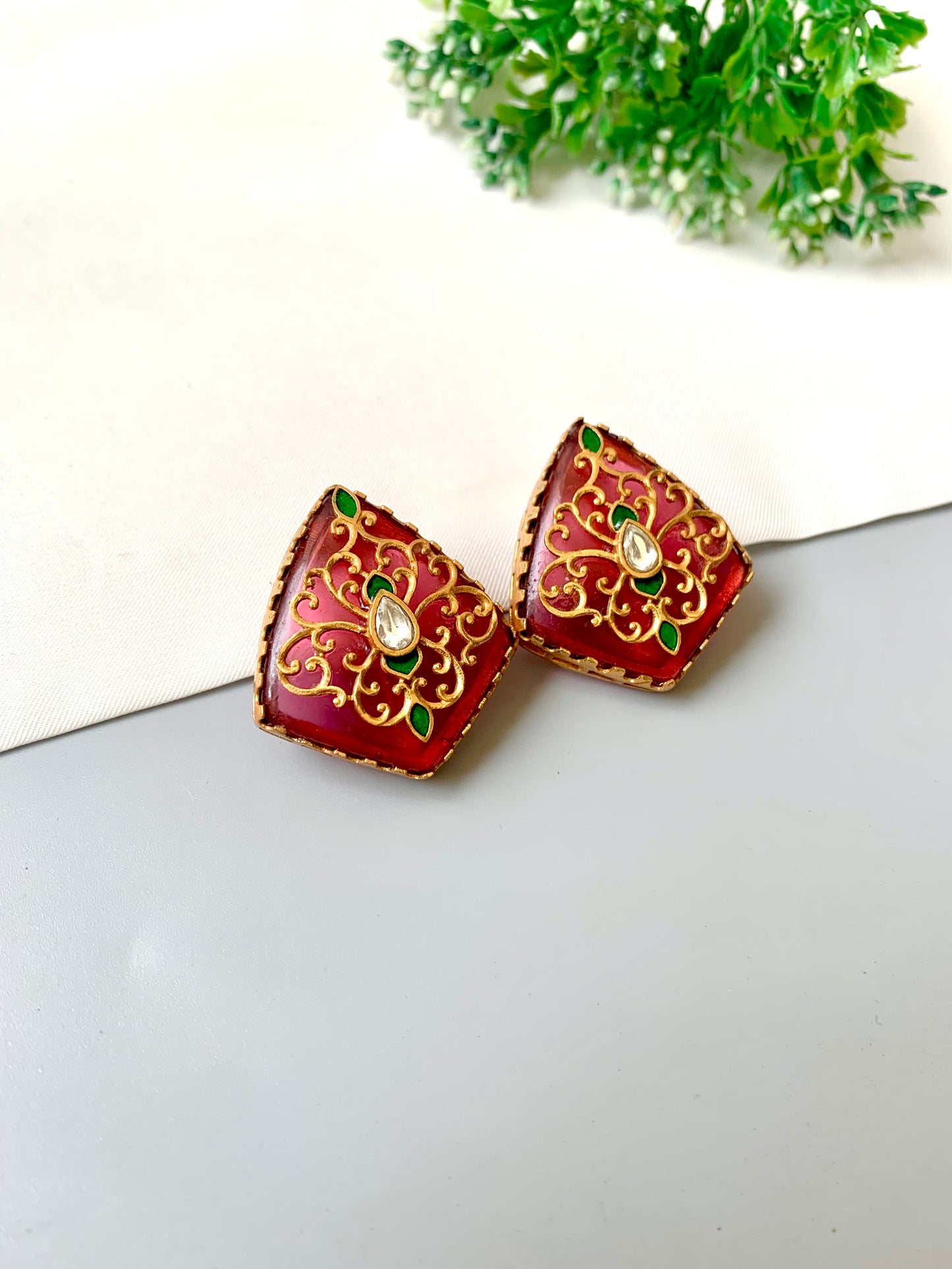 Close-up of Gul Meena Studs showing kundan bezel and ruby enamel — Zamal Jewels