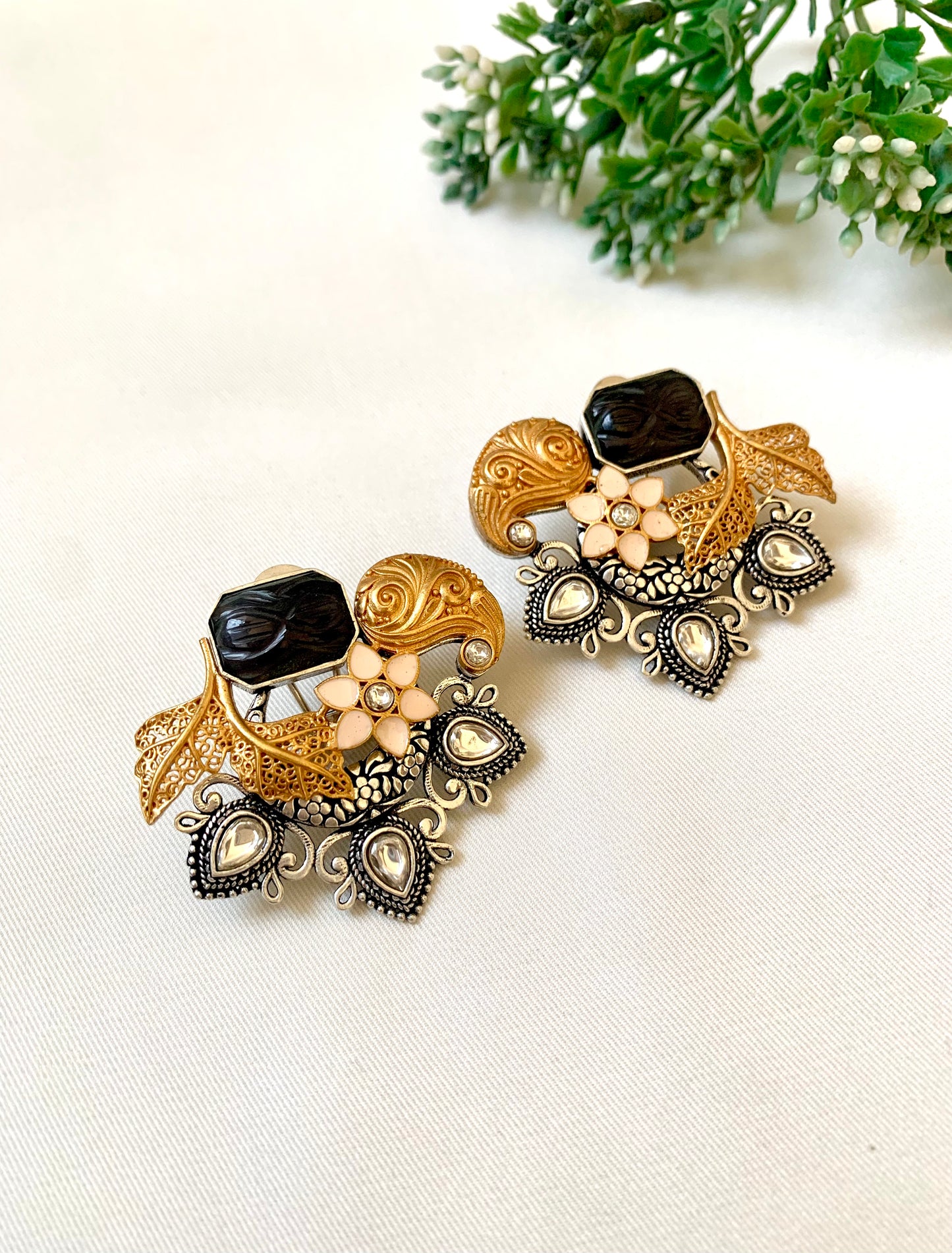 Asymmetric Jesiya studs with black onyx centre, enamel flower and Polki Kundan teardrops — Zamal Jewels