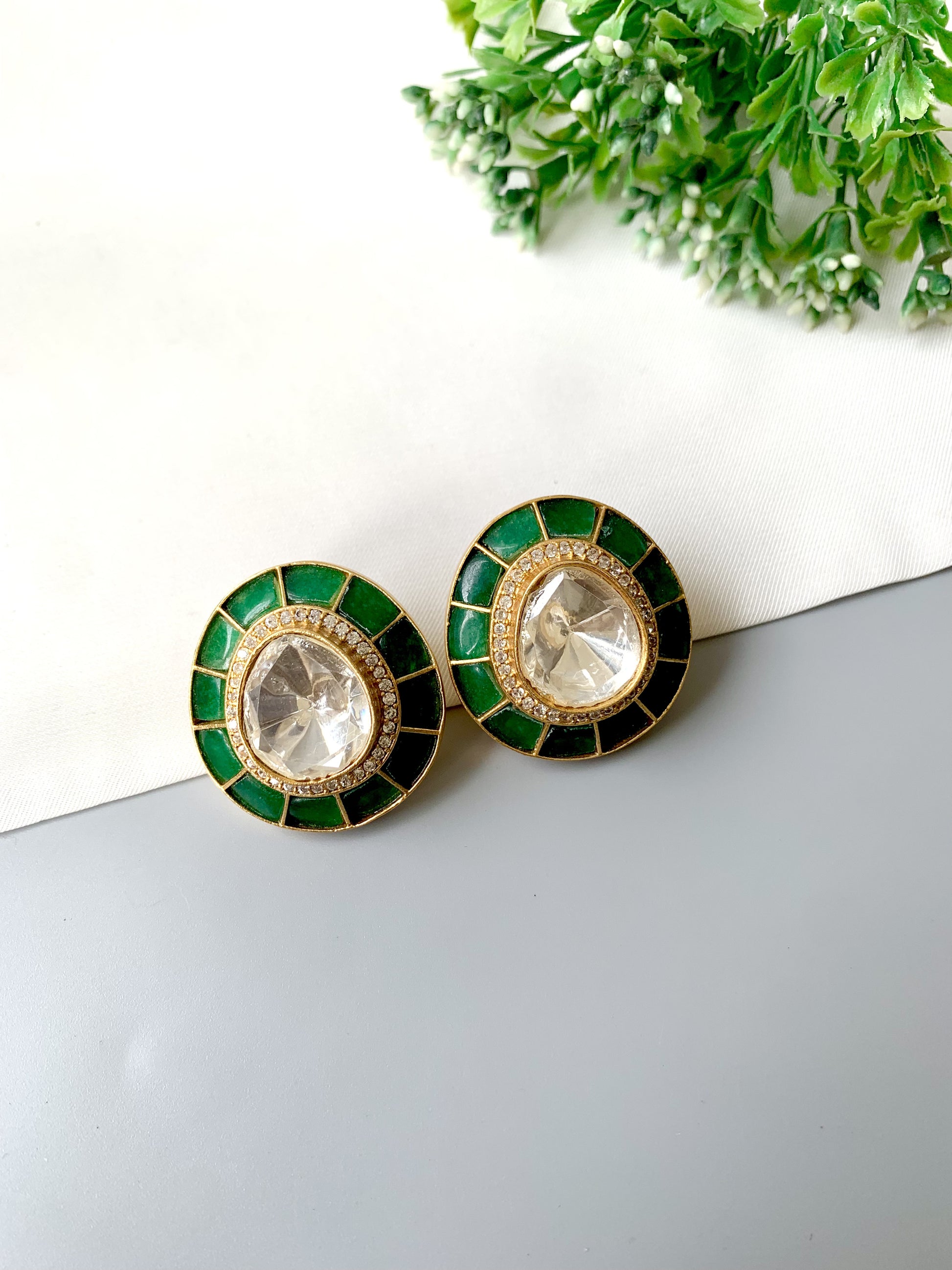 Close-up of Polki Kundan center with emerald tile halo and micro pavé AD, gold finish — Zamal Jewels