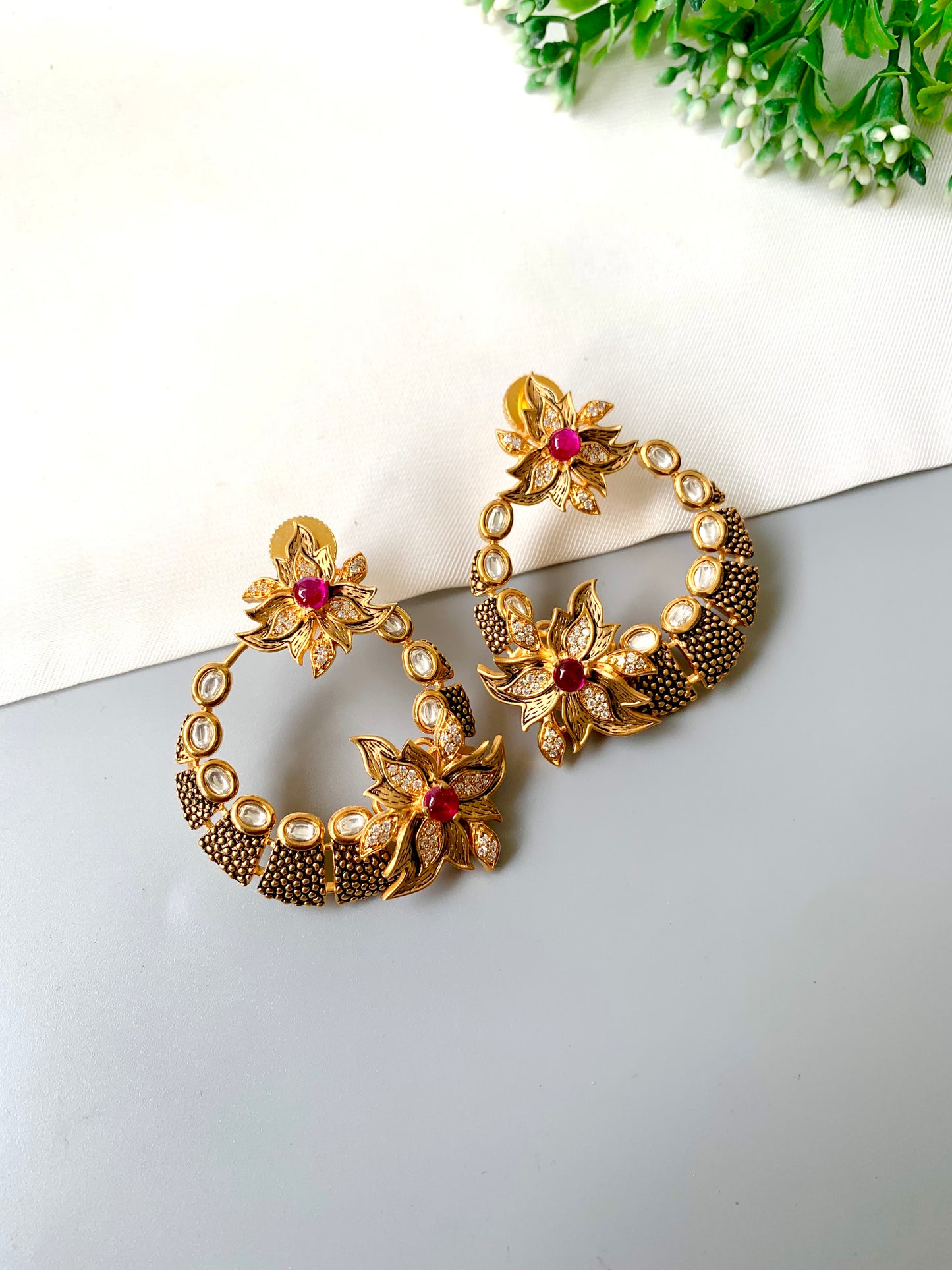 Zareen Ruby Meena hoop earrings showing hand-painted meenakari and AD pavé petals — Zamal Jewels Pakistan