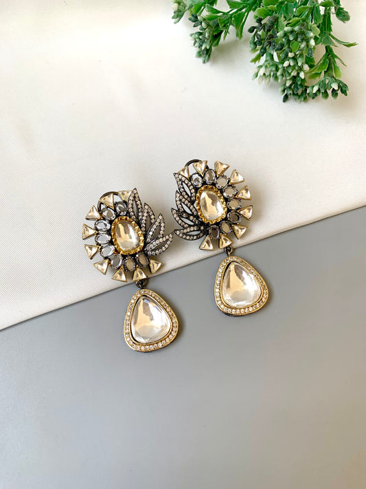Afsana handcrafted signature earrings in gold and rhodium plating with oxidized finish featuring American diamonds and polki kundan