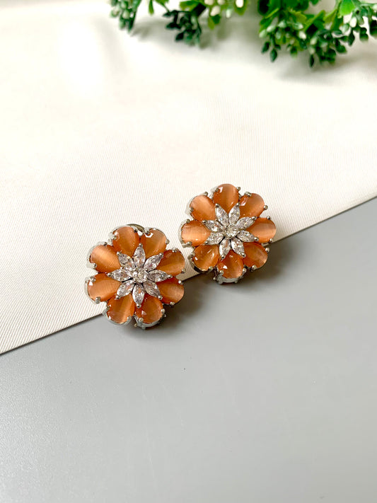 Rhodium plated floral stud earrings featuring semi-precious amber onyx petals and high-quality American Diamonds from Zamal Jewels