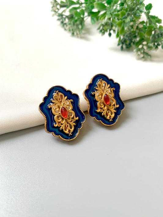 Handcrafted sapphire blue Meena studs with 22kt gold plating and Polki Kundan detail from Zamal Jewels.