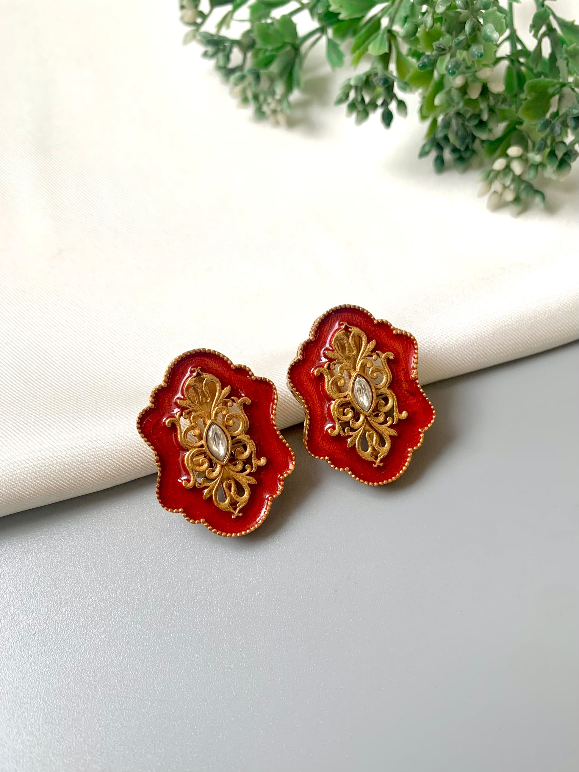 Handcrafted Anisa Studs in rich red Meena enamel with 22kt gold plating and Polki Kundan detail, by Zamal Jewels.