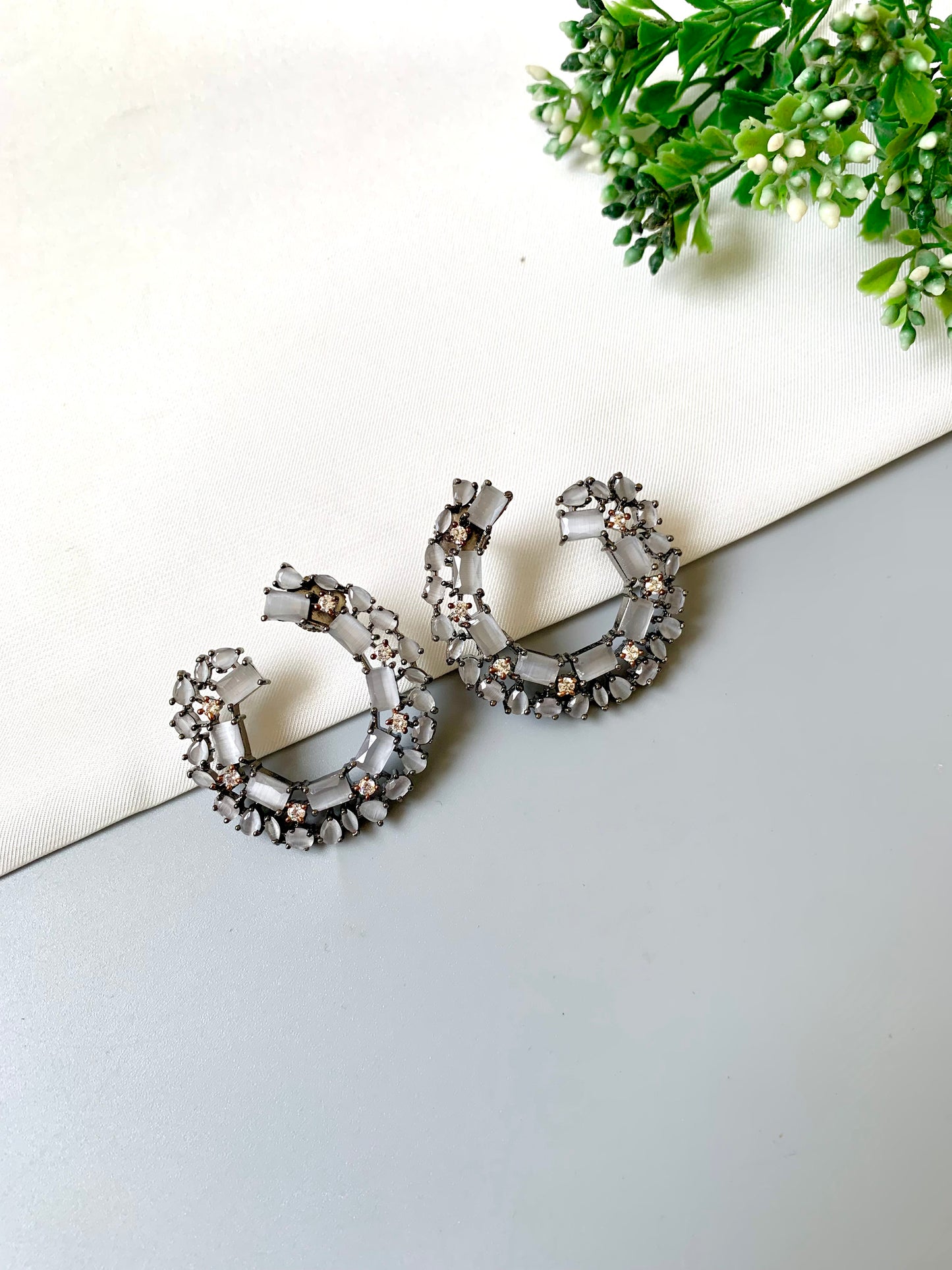 Arden Hoops with oxidized rhodium plating, American Diamonds, and semi-precious onyx in a circular studded design