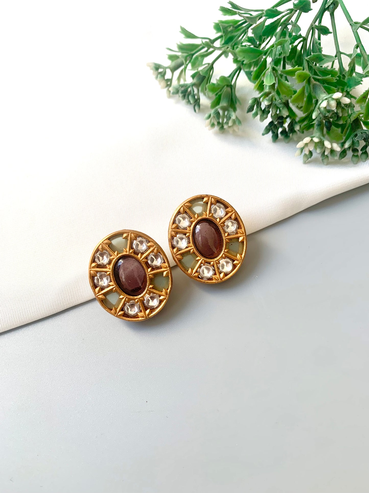 Front view of Asmita Amethyst studs with central amethyst, Polki Kundan, and natural gemstone accents in Victorian gold.