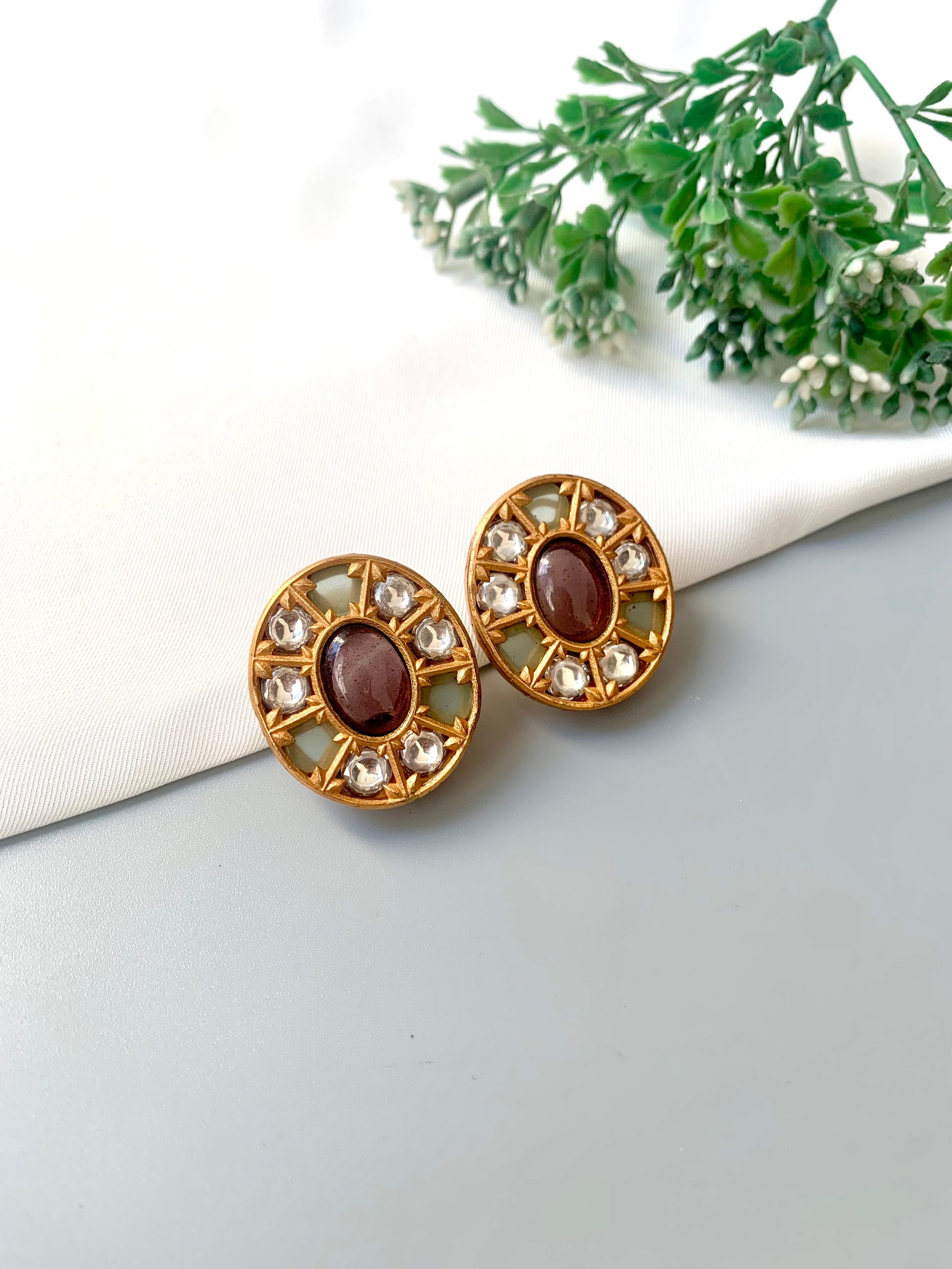 Side view of Asmita Amethyst studs showing detailed gemstone arrangement and handcrafted gold frame.