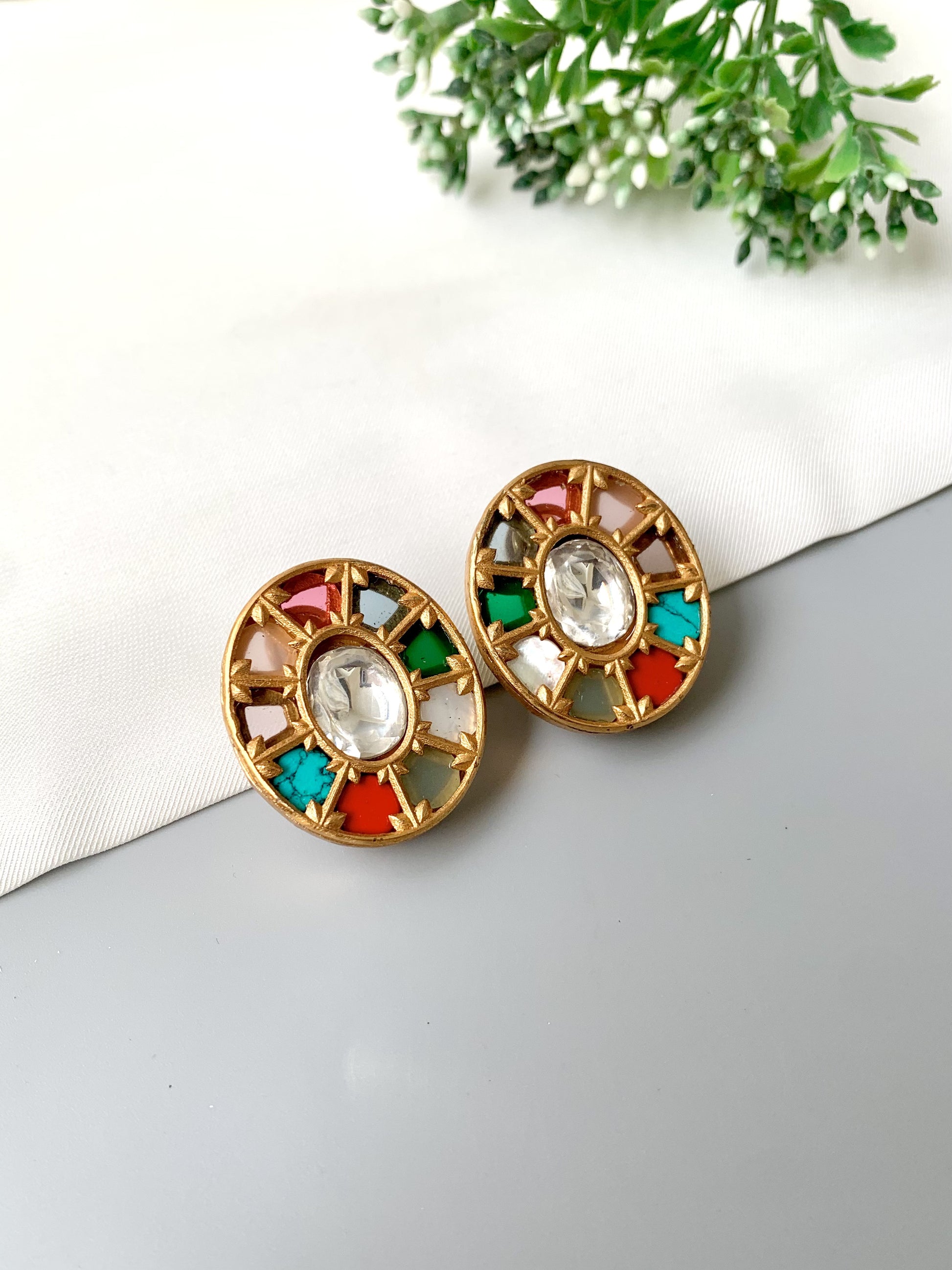 Side-angle image of Asmita Multi earrings with vibrant gemstone accents and gold craftsmanship.