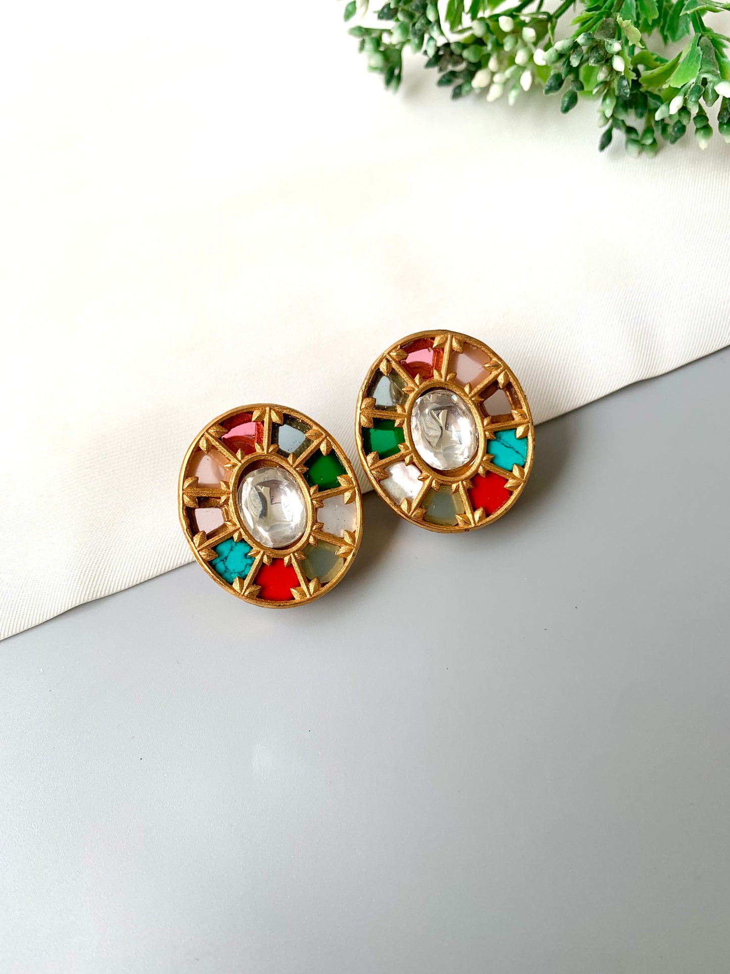 Top view of Asmita Multi studs showing detailed circular setting with multicolor stones.