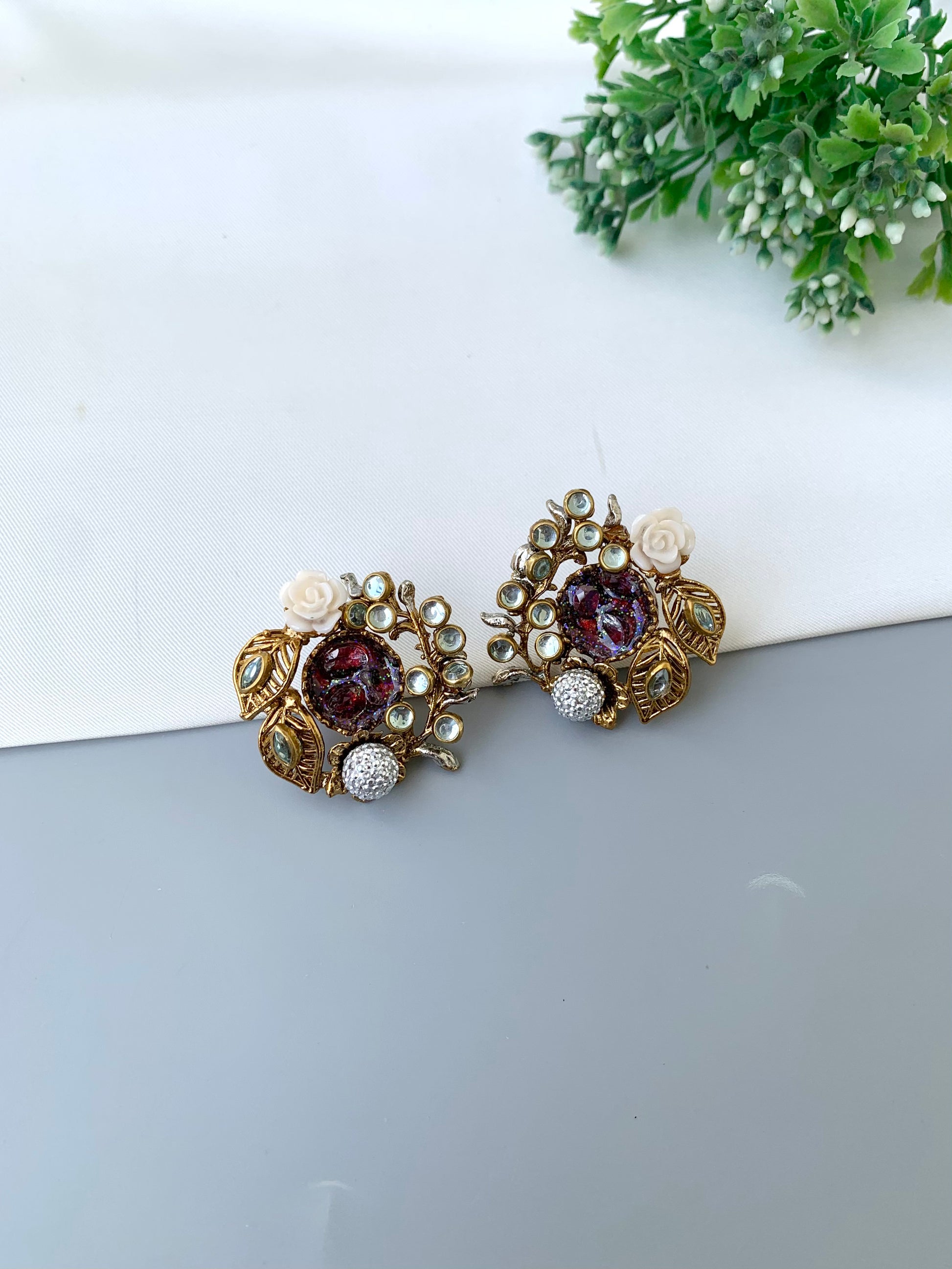 Athena ruby kundan earrings in gold plating with American diamonds and gemstone detailing