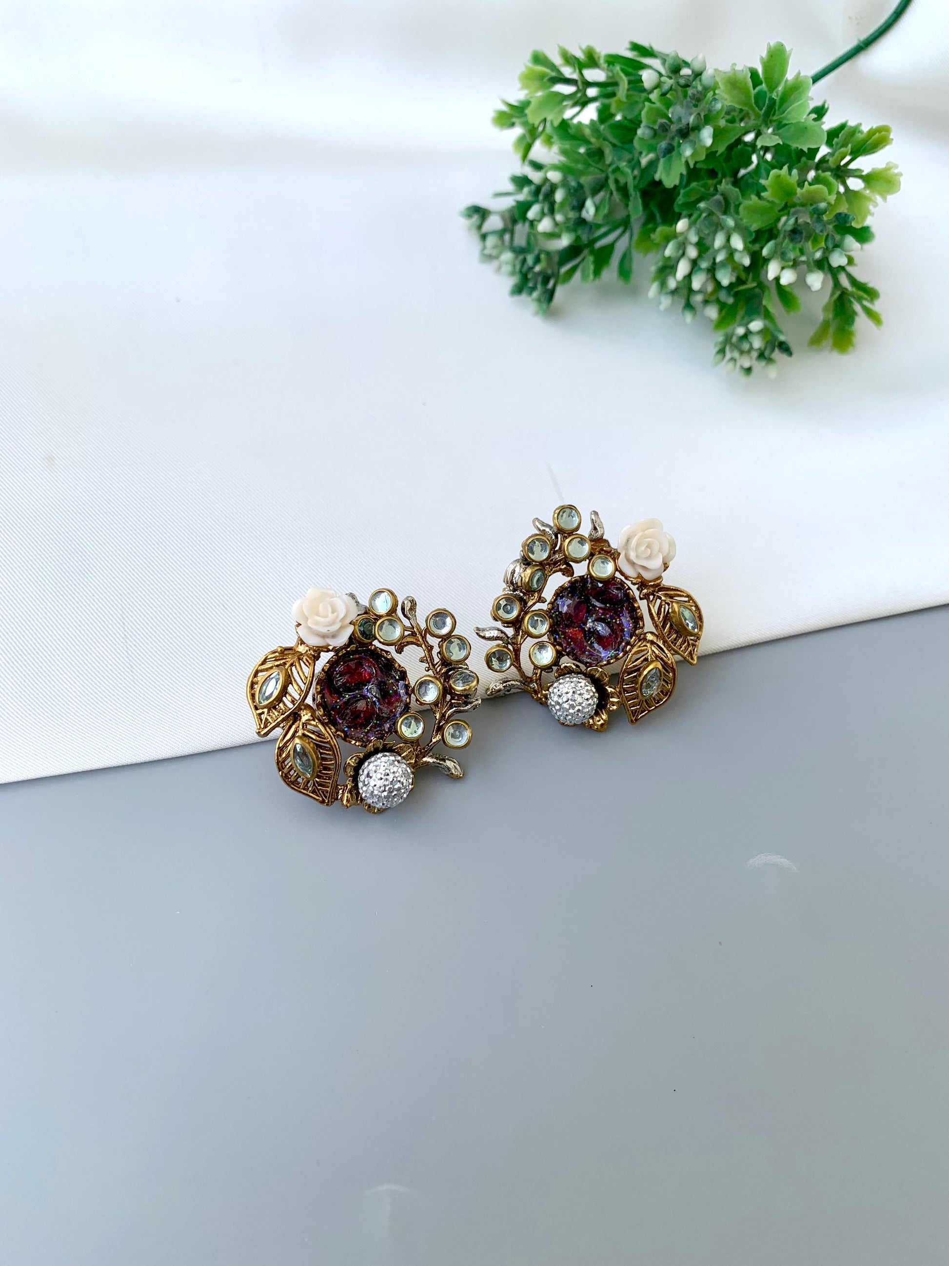 Athena ruby kundan earrings in gold plating with American diamonds and gemstone detailing