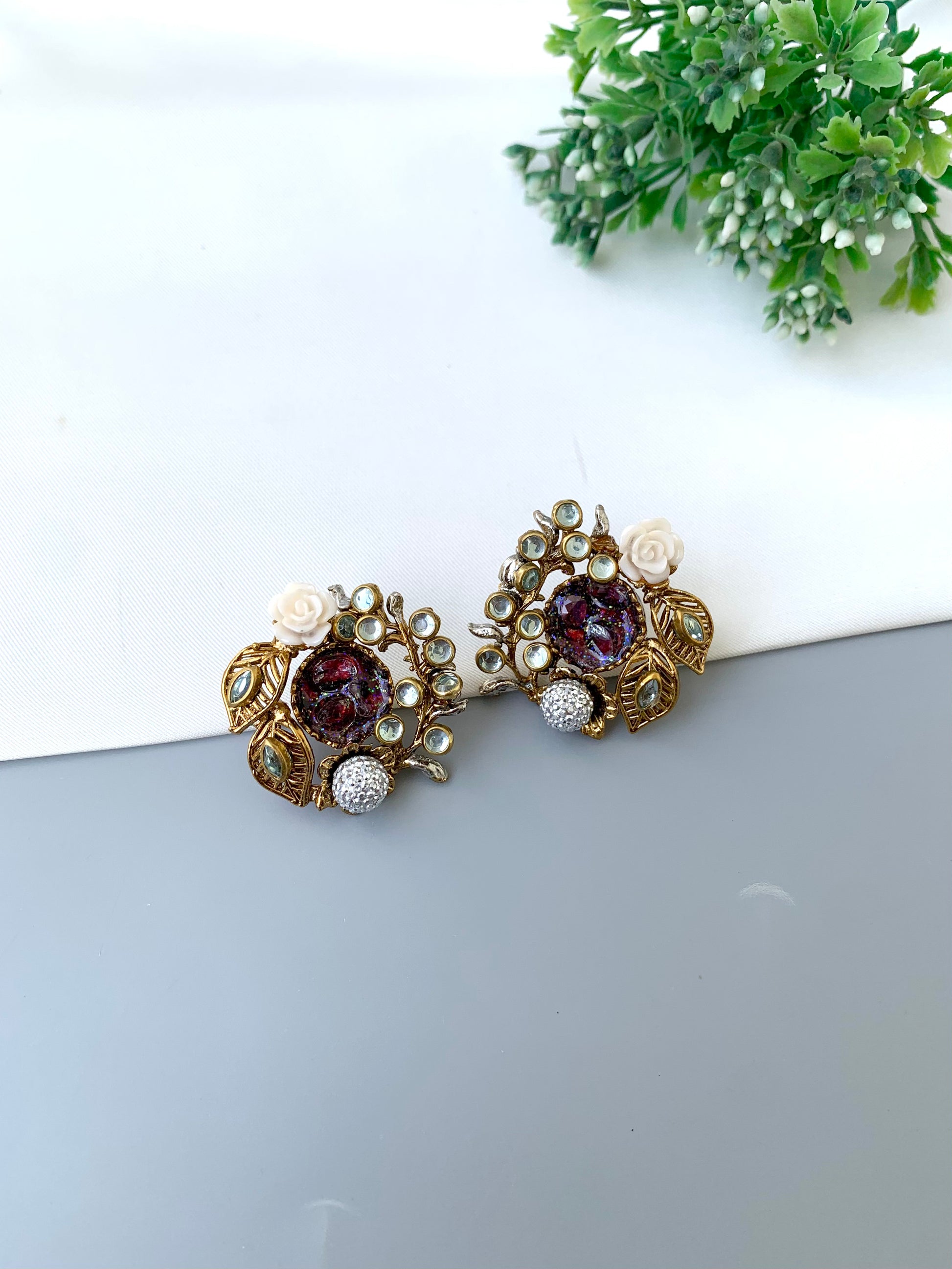 Athena ruby kundan earrings in gold plating with American diamonds and gemstone detailing
