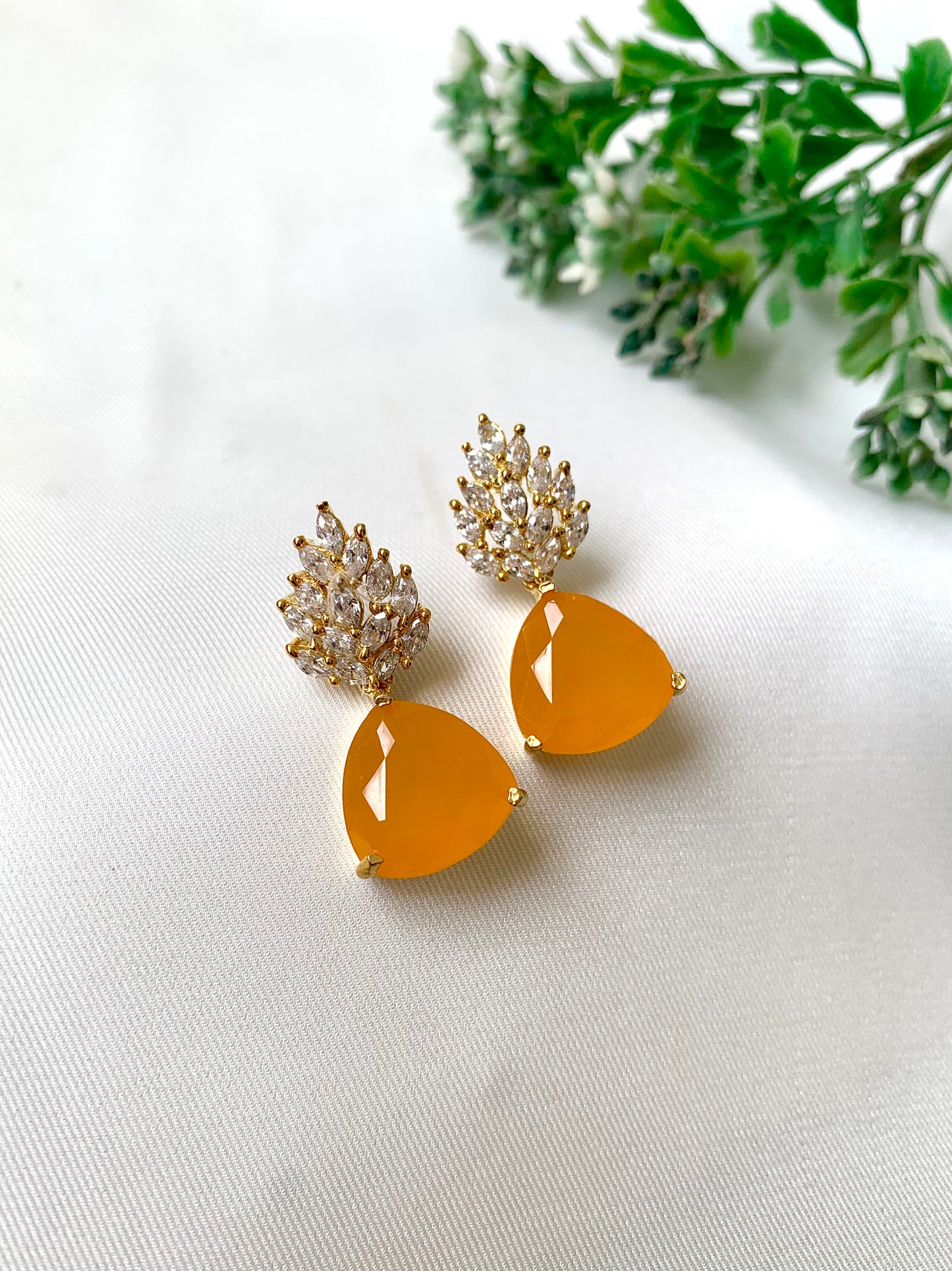 Handcrafted designer earrings with citrine stone and diamond cluster top
