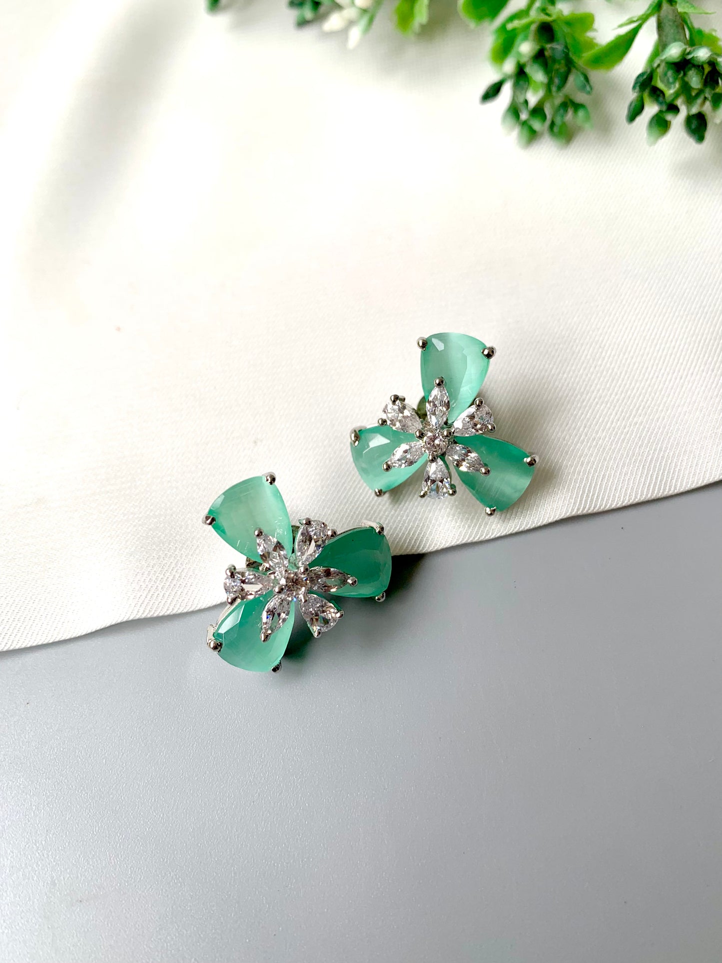 Mint green Onyx floral studs with American Diamonds in platinum polish by Zamal Jewels