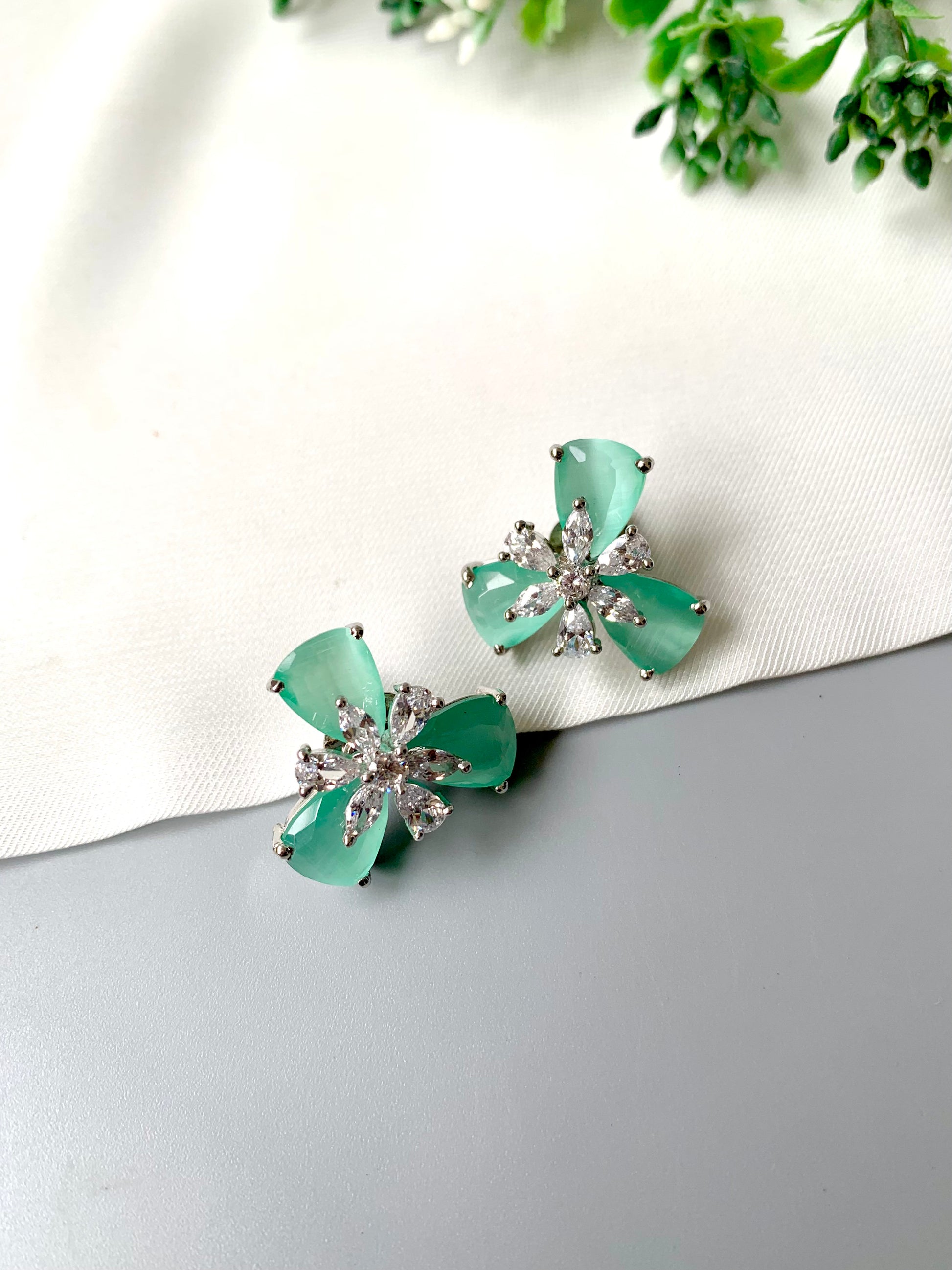 Mint green Onyx floral studs with American Diamonds in platinum polish by Zamal Jewels