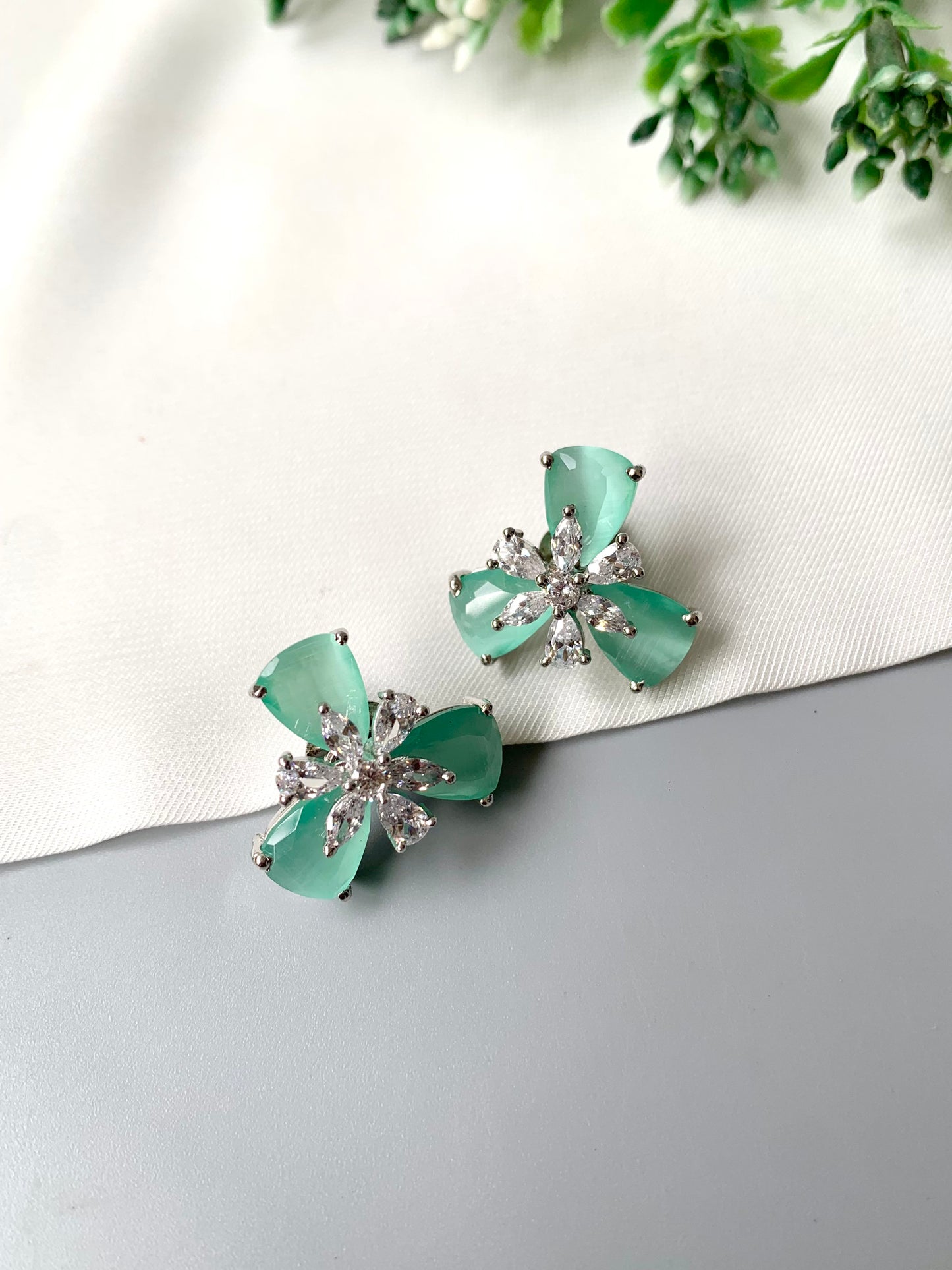 Mint green Onyx floral studs with American Diamonds in platinum polish by Zamal Jewels