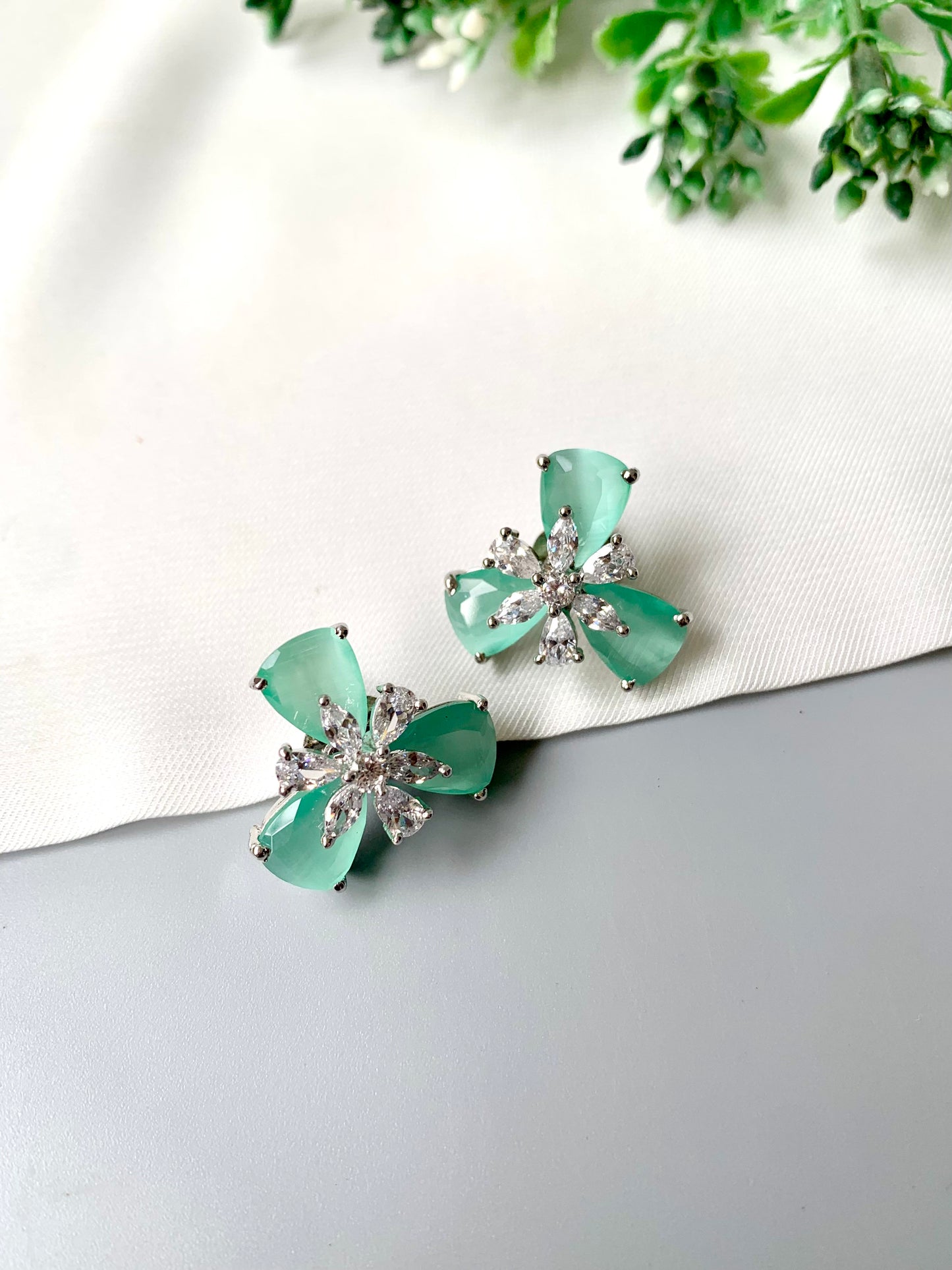Mint green Onyx floral studs with American Diamonds in platinum polish by Zamal Jewels