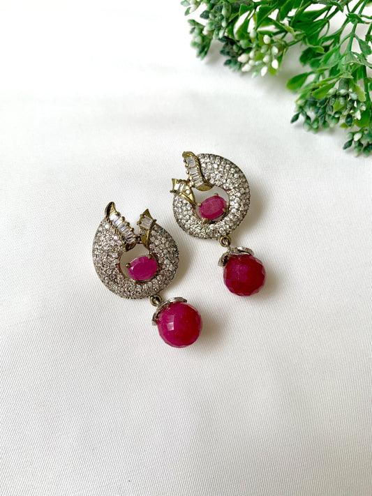 Close-up of handcrafted ruby earrings with American Diamonds in rhodium Victorian finish from Zamal Jewels