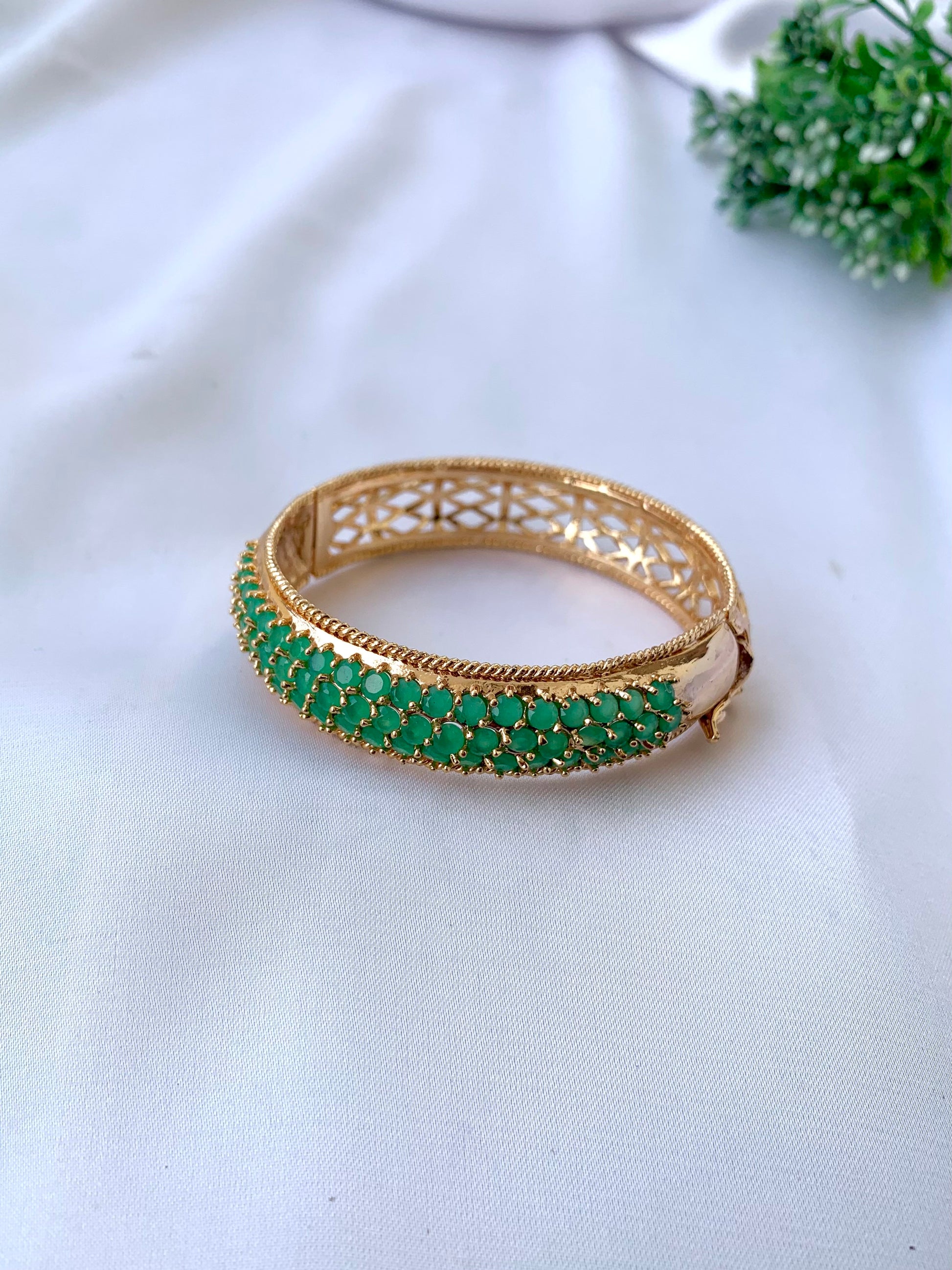 Azeena emerald gold plated openable bangle with minimal gemstone design