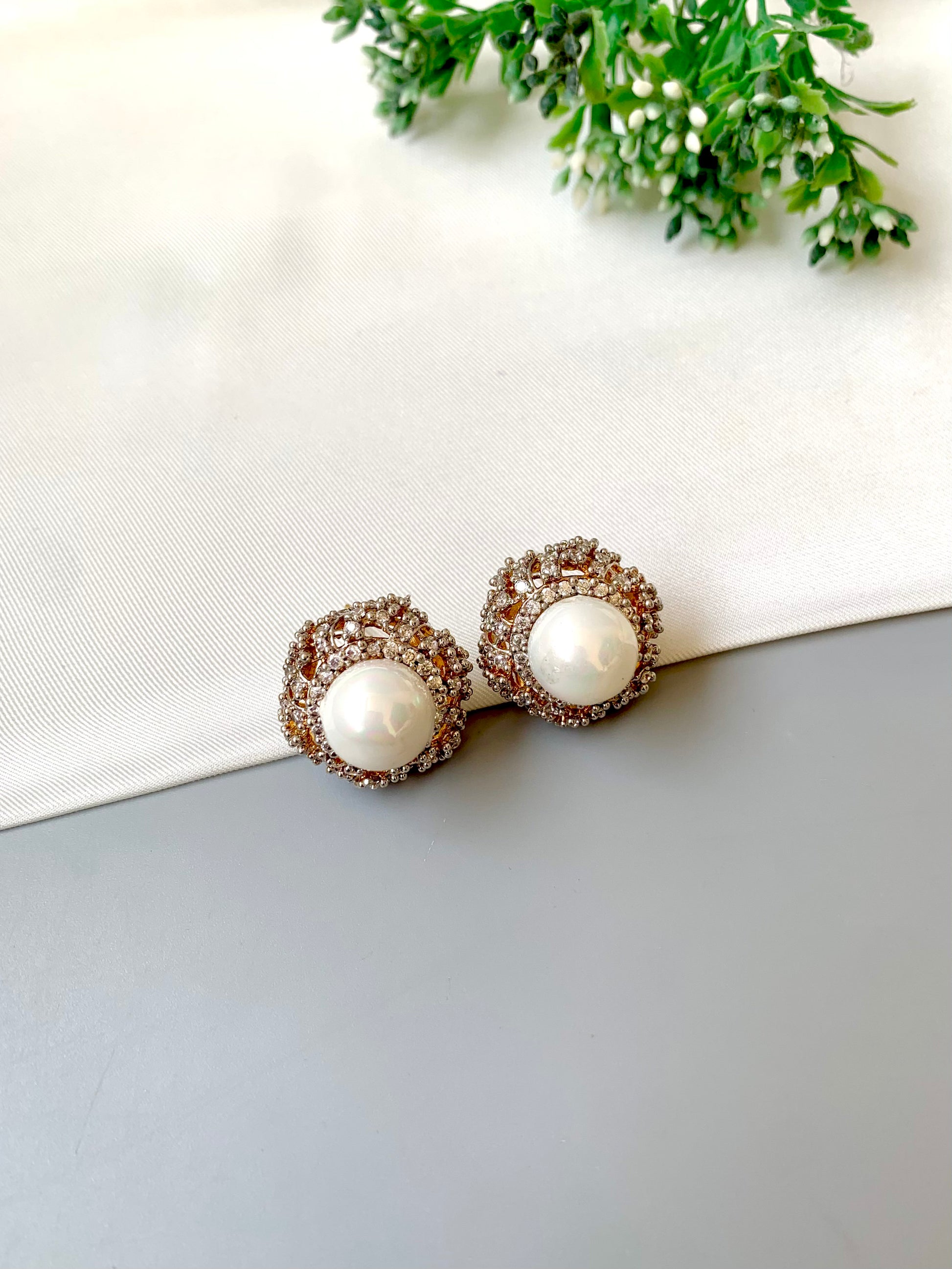 Belle signature pearl studs with American diamonds in rose tone setting