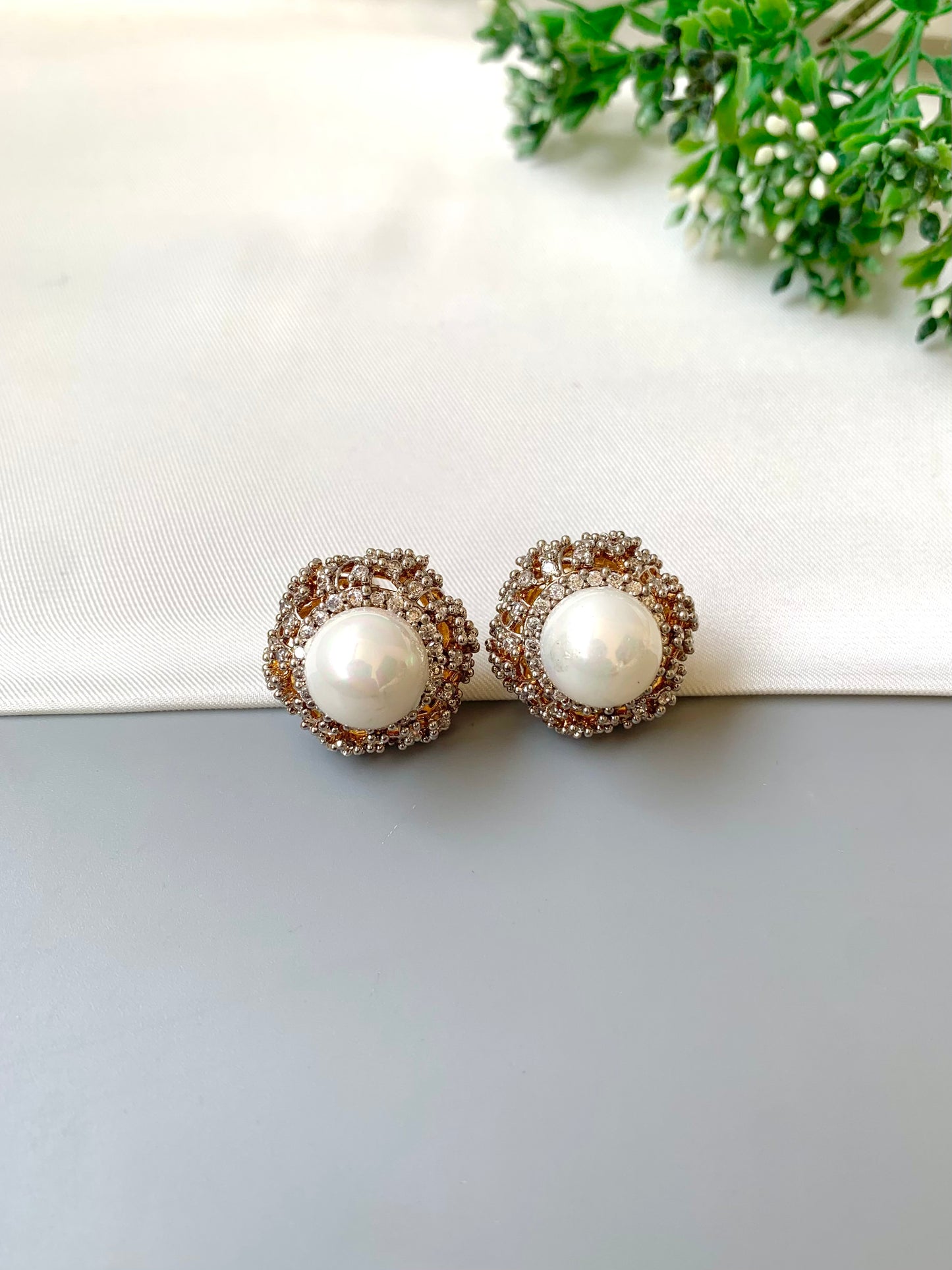 Belle signature pearl studs with American diamonds in rose tone setting