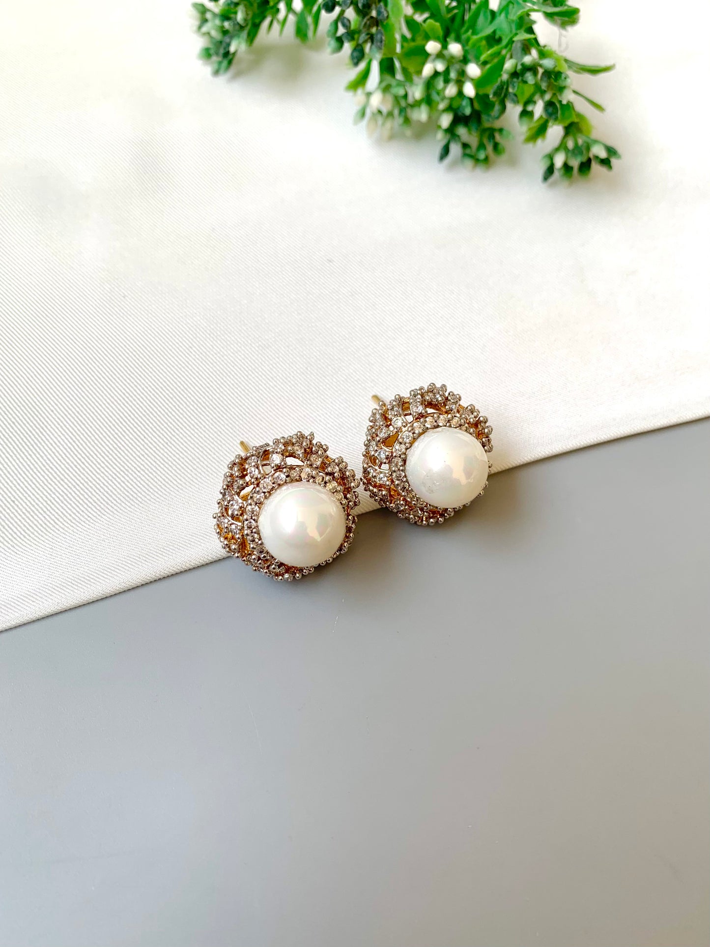 Belle signature pearl studs with American diamonds in rose tone setting