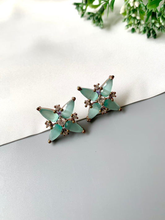Handcrafted mint onyx star-shaped studs with American Diamonds in oxidized gold plating – front angle