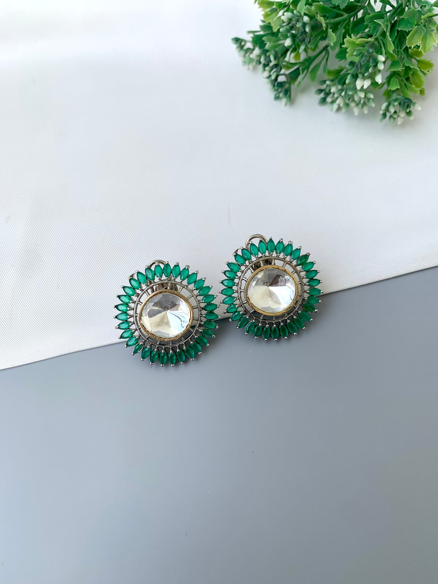 Cila emerald polki kundan studs in rhodium plating with semi precious gemstone