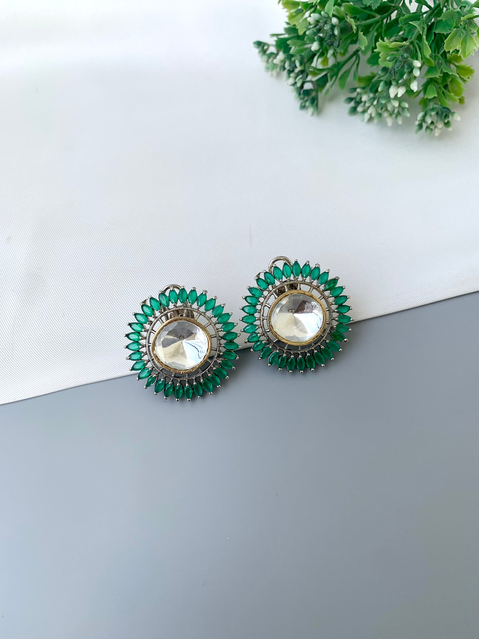 Cila emerald polki kundan studs in rhodium plating with semi precious gemstone