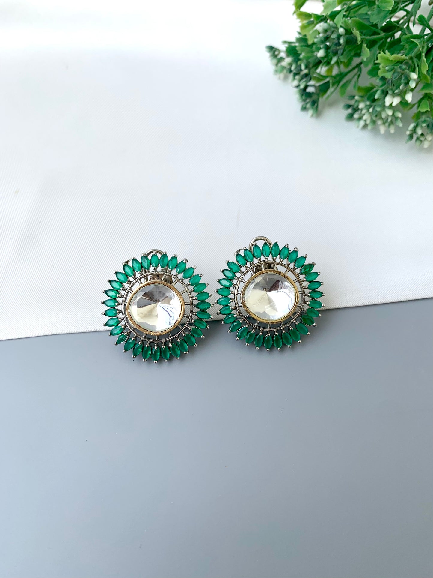 Cila emerald polki kundan studs in rhodium plating with semi precious gemstone