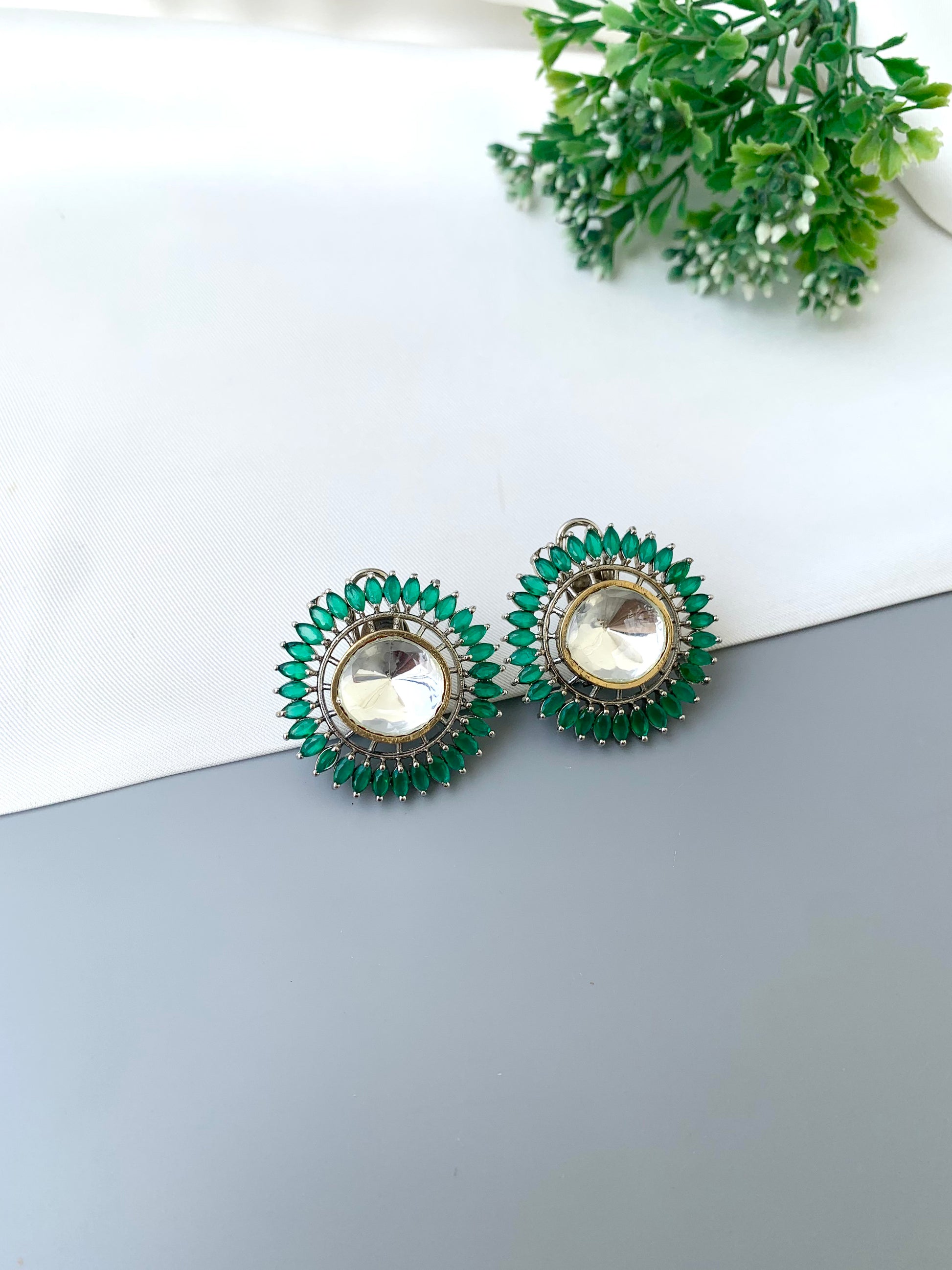 Cila emerald polki kundan studs in rhodium plating with semi precious gemstone
