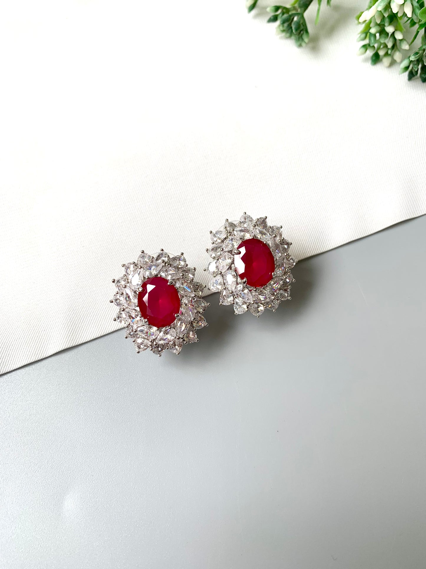 Luxury ruby and diamond stud earrings in platinum finish – side view