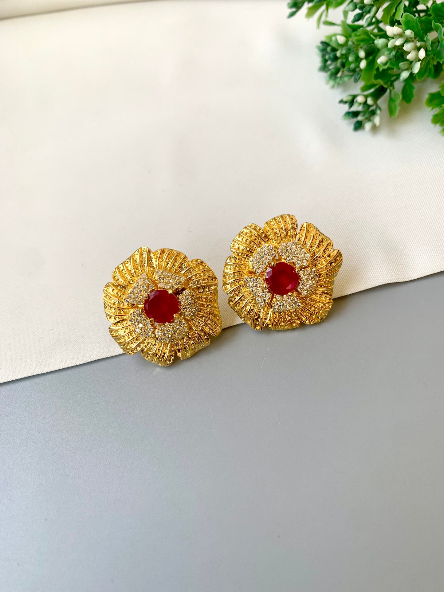 Hand crafted Crimson Studs in 22kt gold plating with American diamonds and semi-precious ruby stones