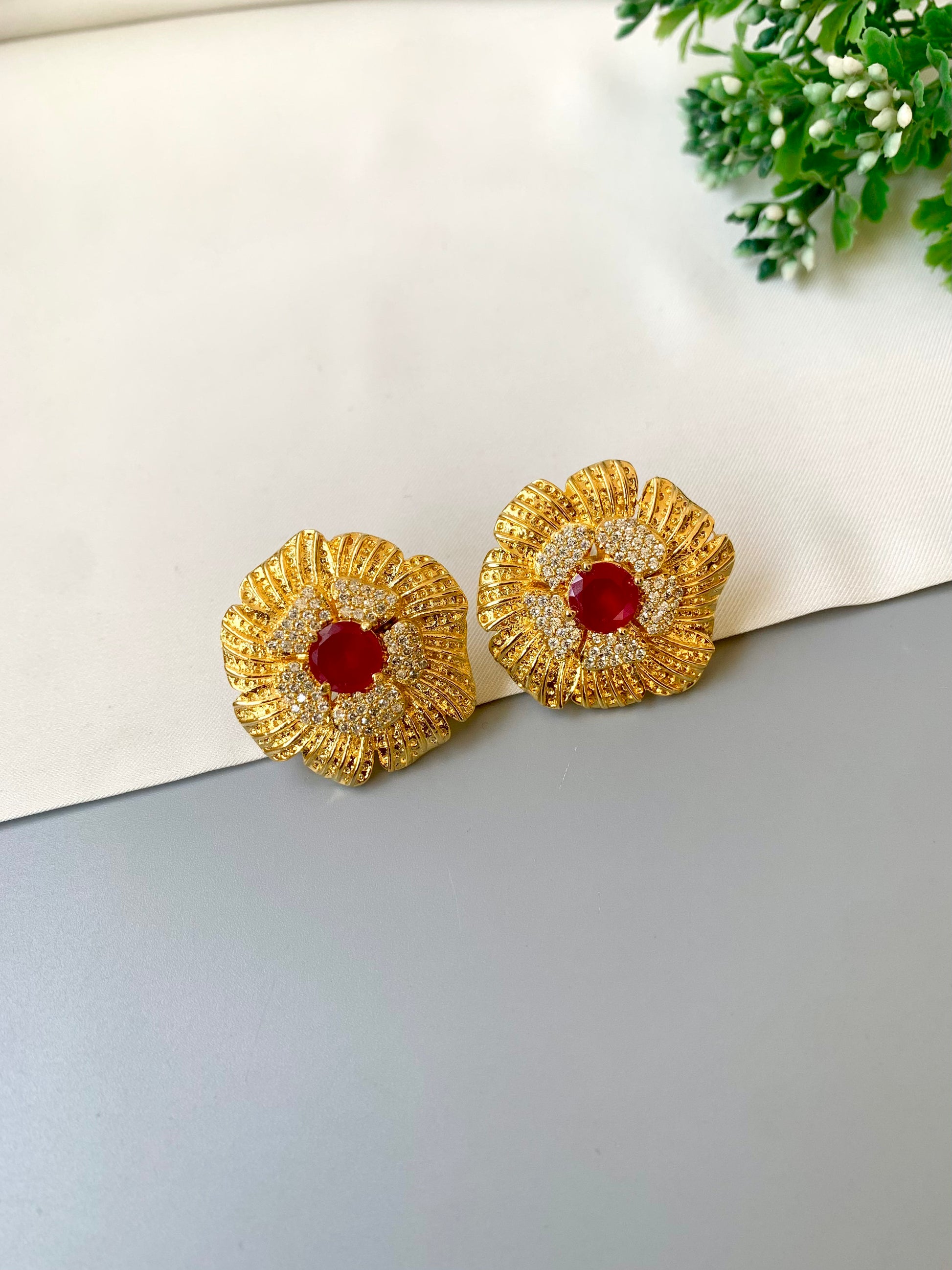 Hand crafted Crimson Studs in 22kt gold plating with American diamonds and semi-precious ruby stones