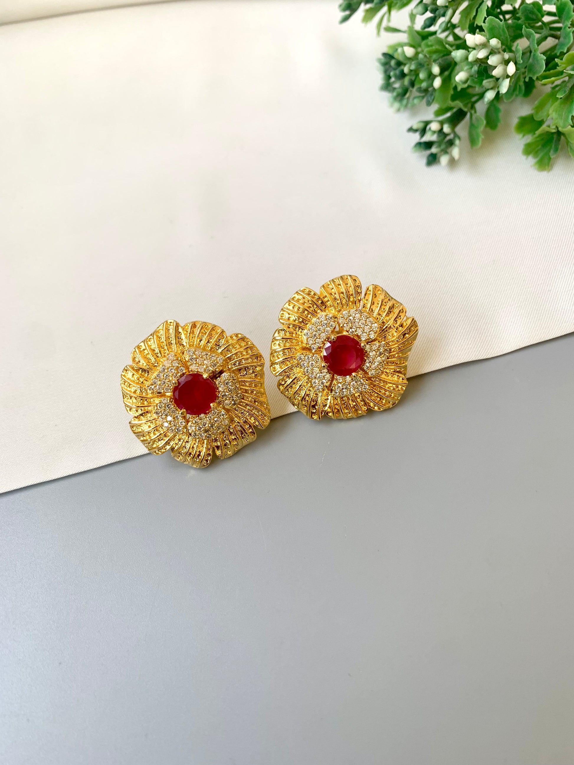 Hand crafted Crimson Studs in 22kt gold plating with American diamonds and semi-precious ruby stones