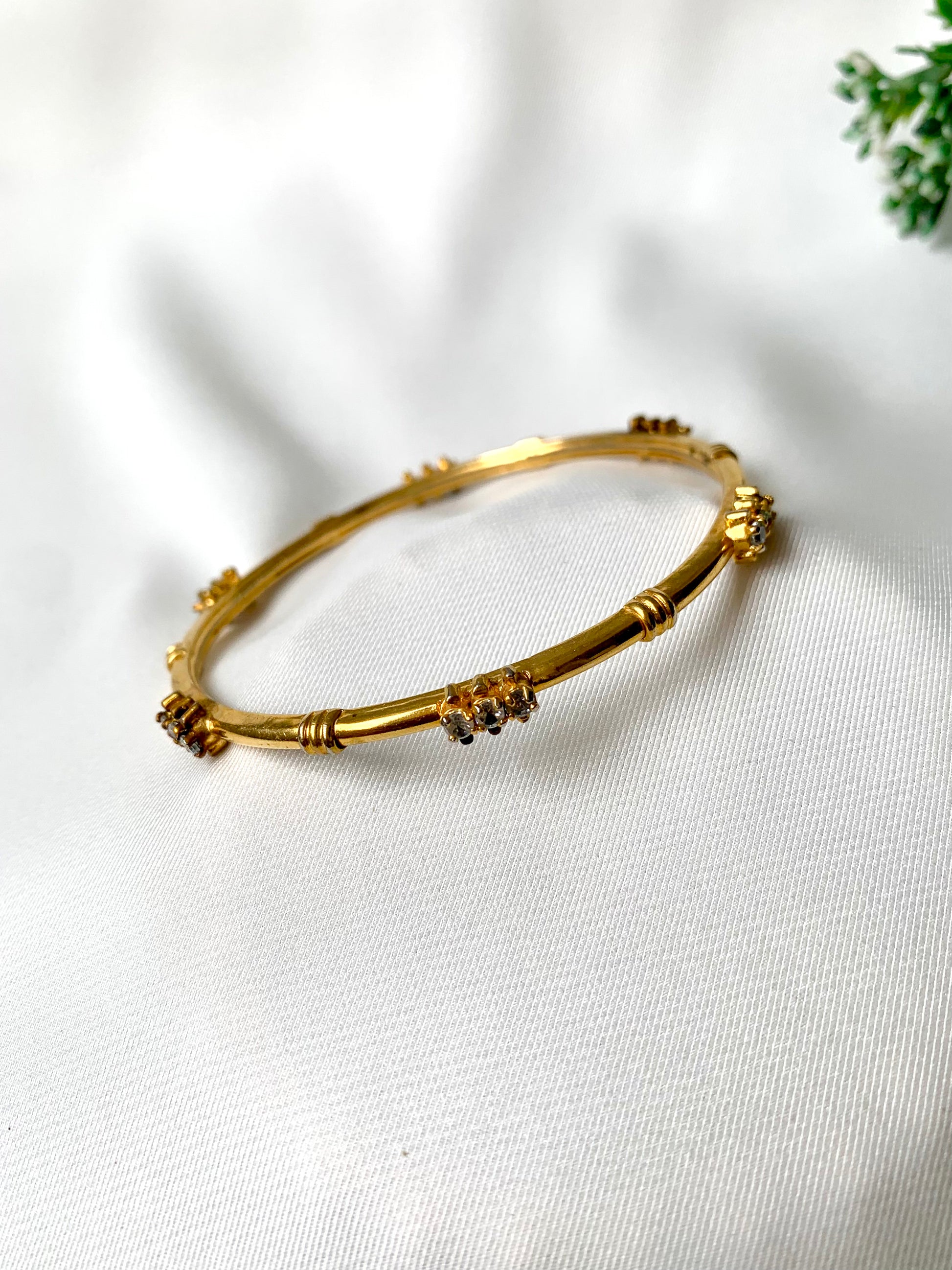 Handcrafted 22kt gold plated bangle with diamond finish and high quality American Diamonds