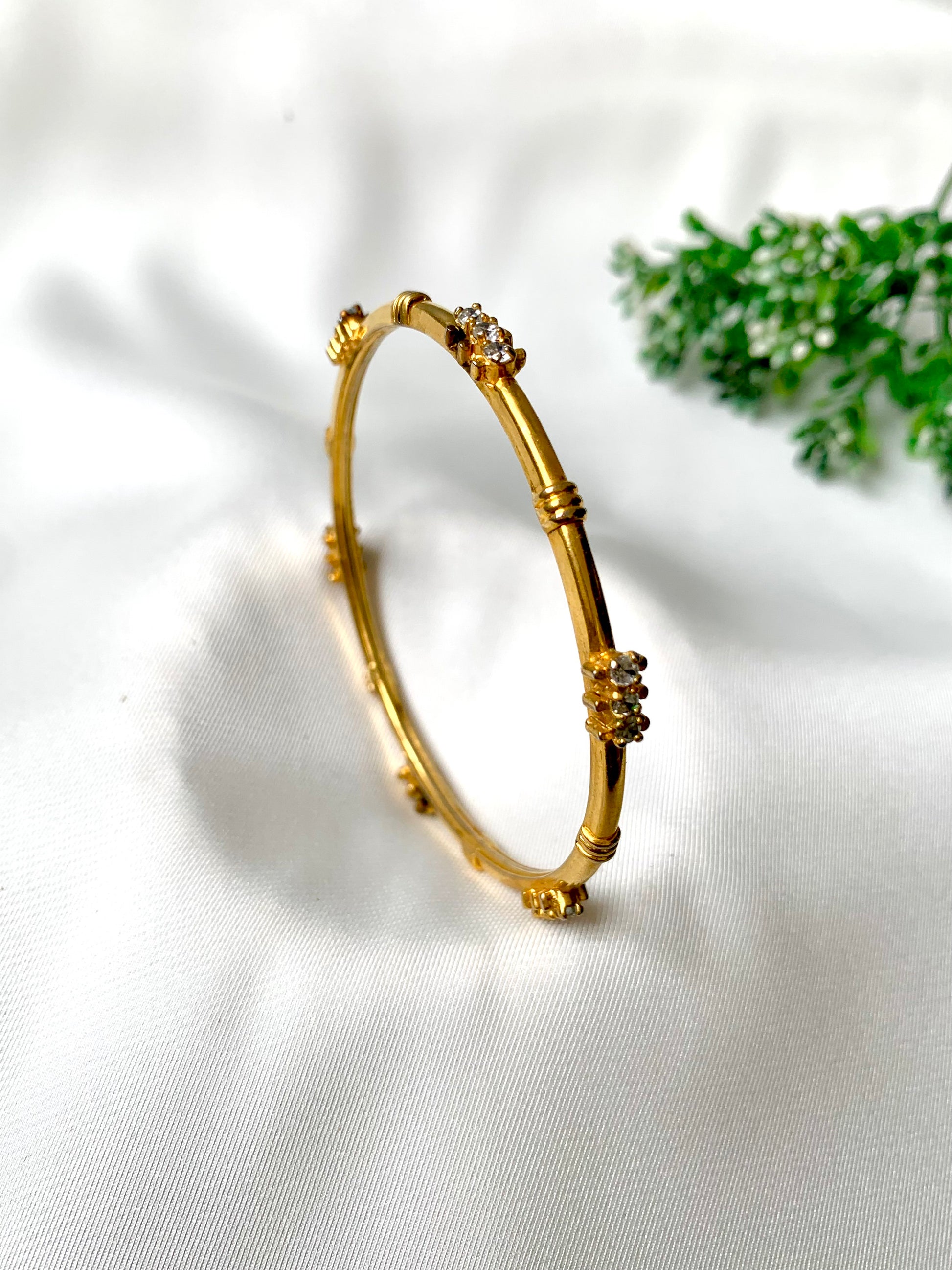 Handcrafted 22kt gold plated bangle with diamond finish and high quality American Diamonds